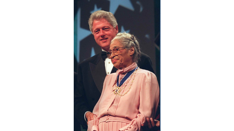 US President Bill Clinton stands with civil rights