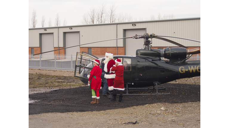 Santa arrives by helicopter at Avant garden centre.