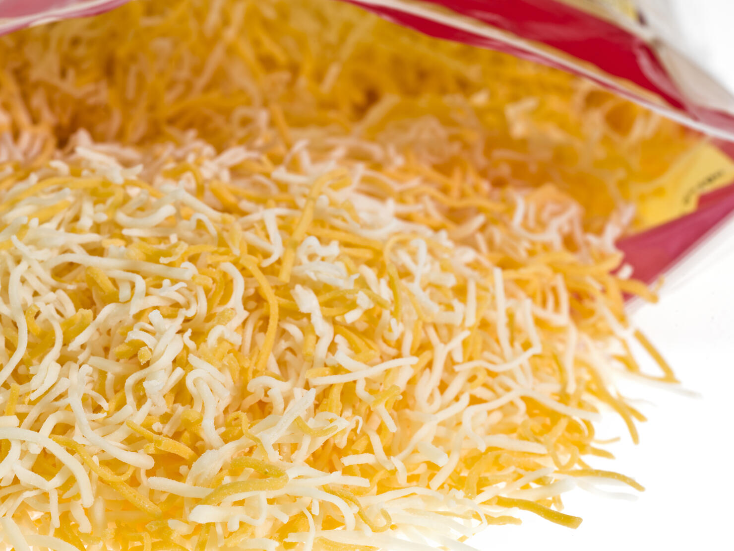Mixed Shredded Cheese Coming out of the Bag
