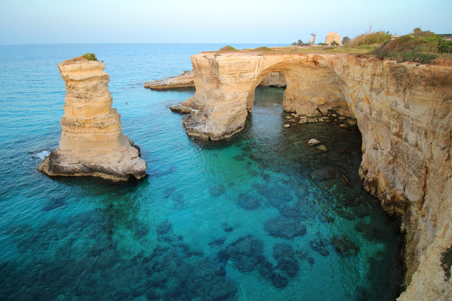 Scenic view of rocks in sea against sky,Melendugno,Lecce,Italy