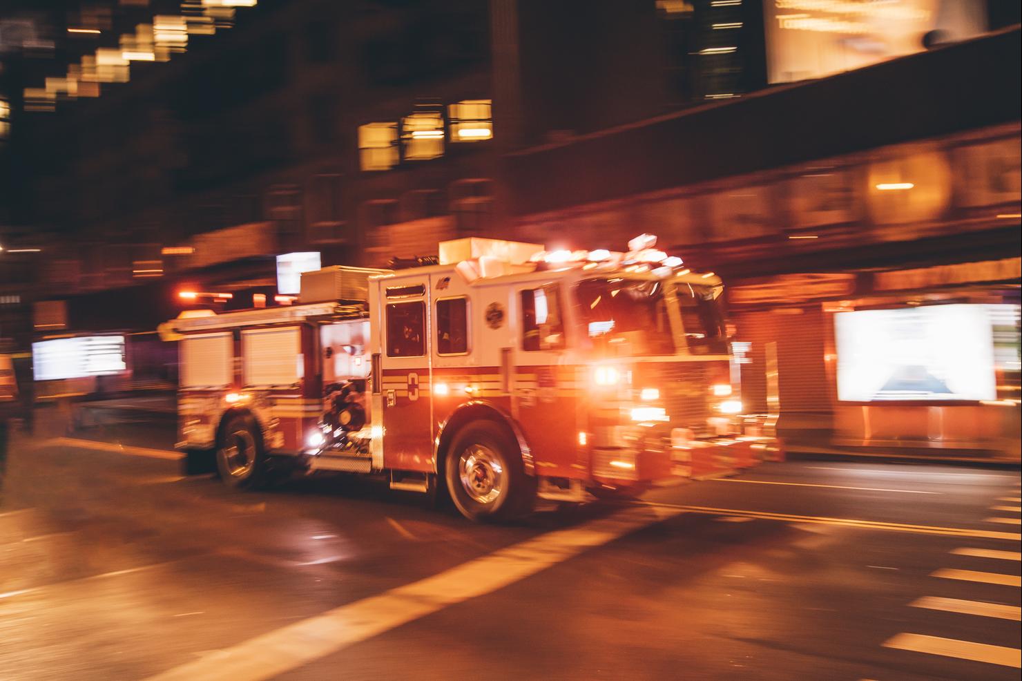 USA, New York City, fire truck coming along the street