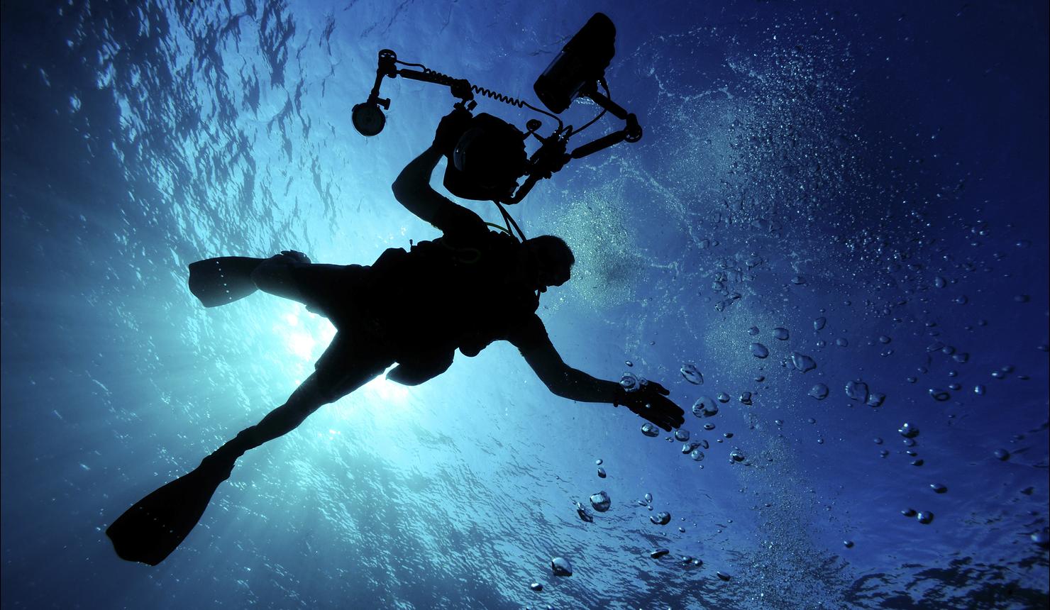 A member of the combat camera underwater photo team.