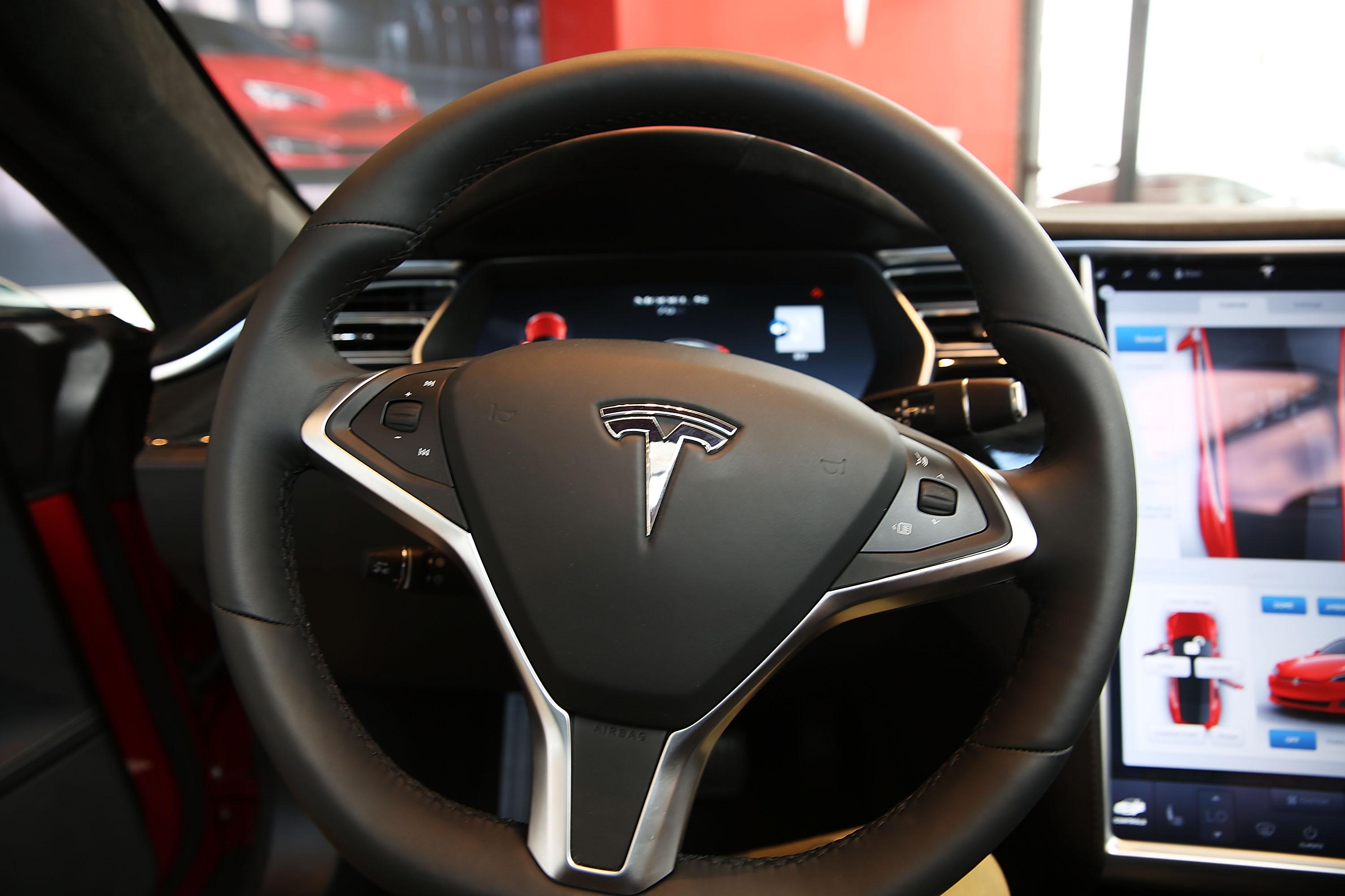 NTSB Says Tesla Driver Fully Accelerated Before Deadly Crash | iHeart