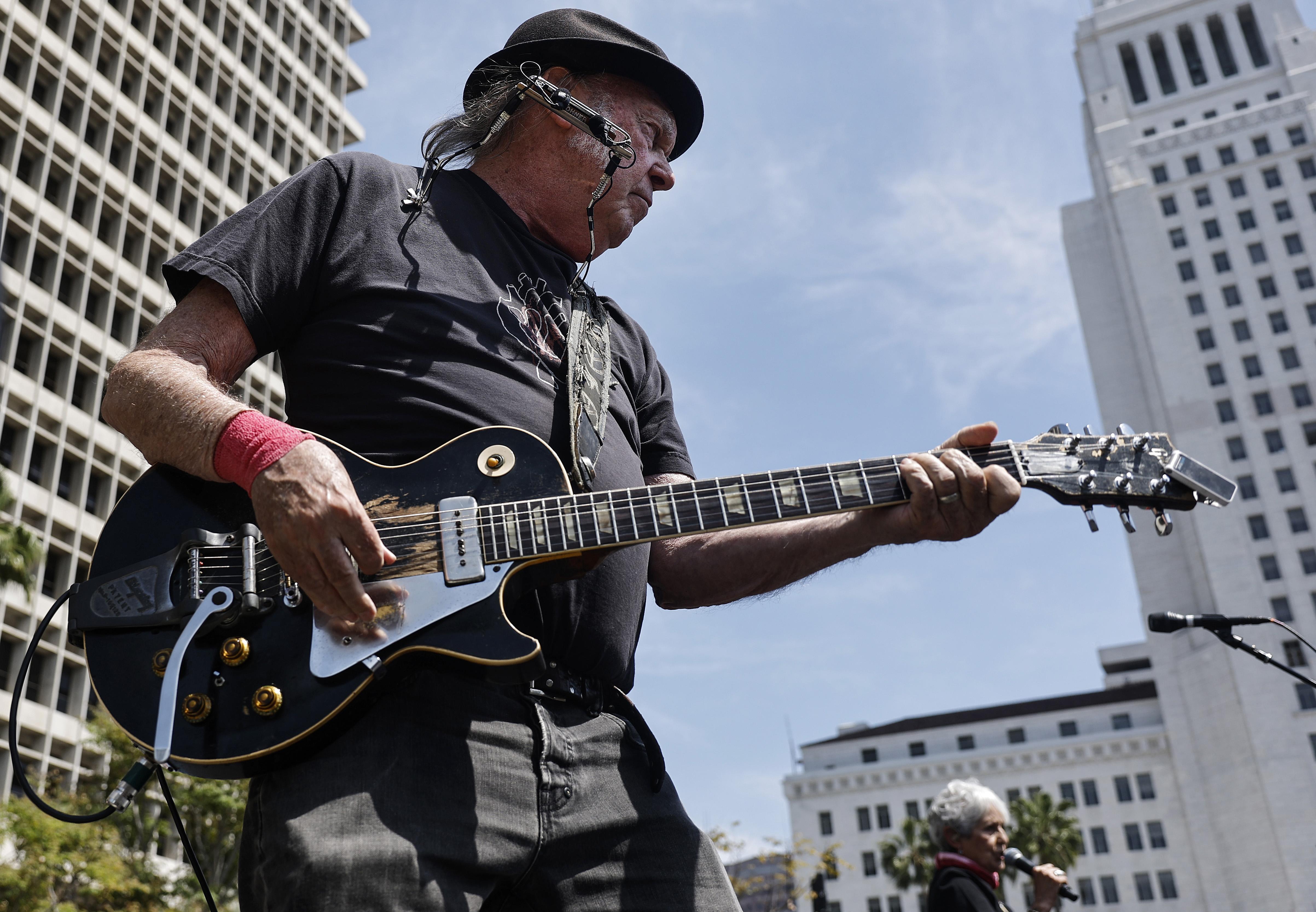 Neil Young Sues Trump PAC For $10M Over Song Use | iHeart