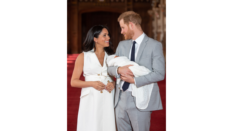 Motherhood clearly fits Meghan as she debuts newborn, Archie, to the public in a white Grace Wales Bonner tux dress with nude suede heels. The best accessories: a tie between her husband's loving gaze and adorable baby boy.