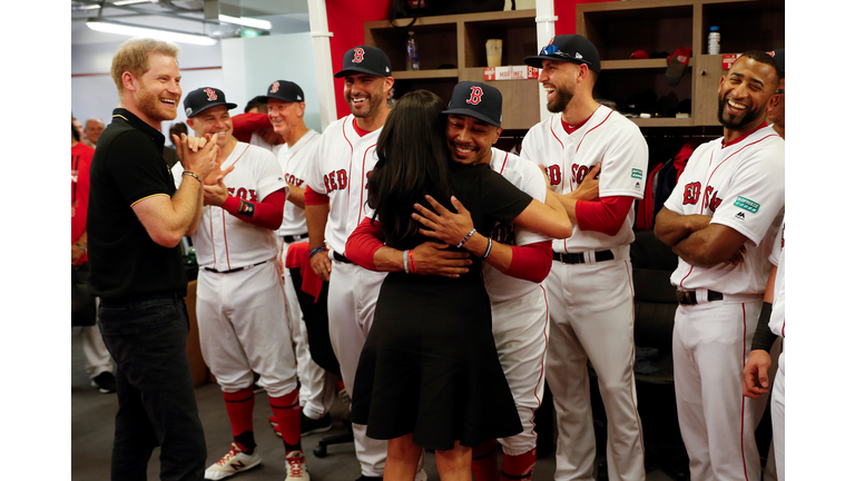 Meghan Markle hugs Mookie Betts. 