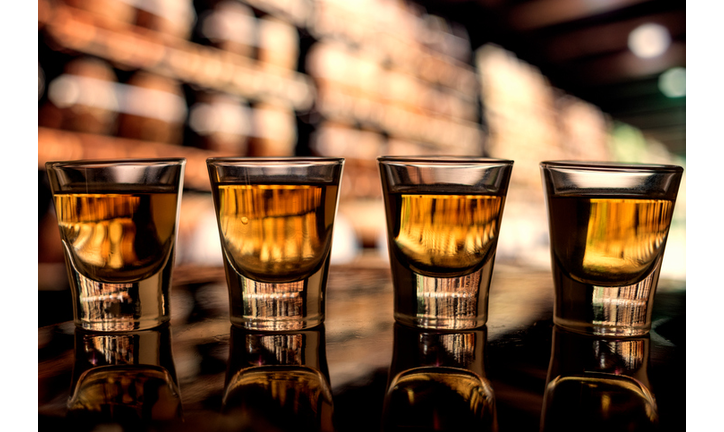 Close-Up Of Shot Glasses - GettyImages-763268411