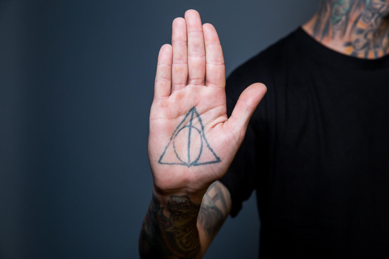 The Deathly Hallows Symbol Hand Tattoo