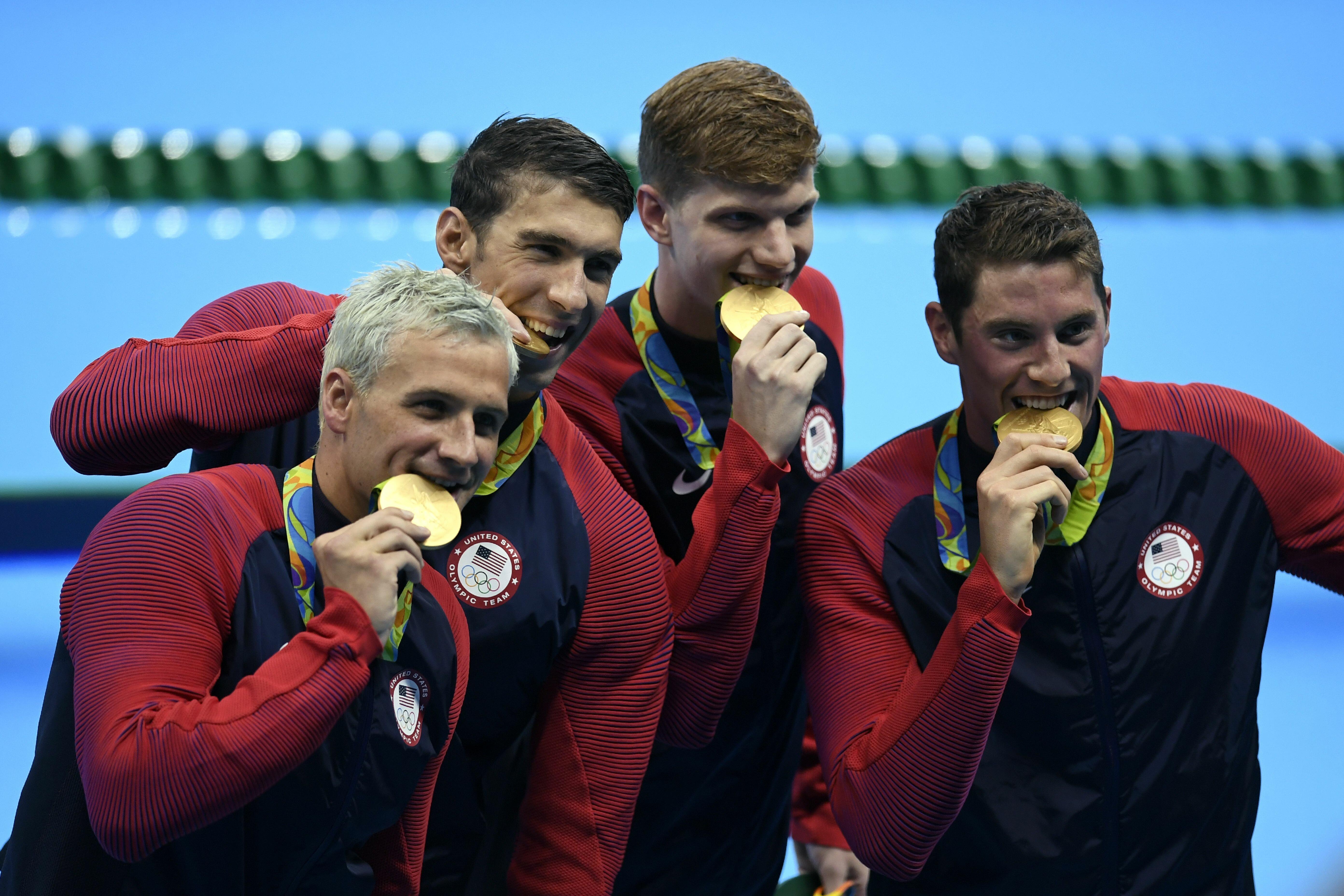 Here S The Real Reason Why Olympians Bite Their Medals IHeart   57add8cbac0daf4ded53ead9