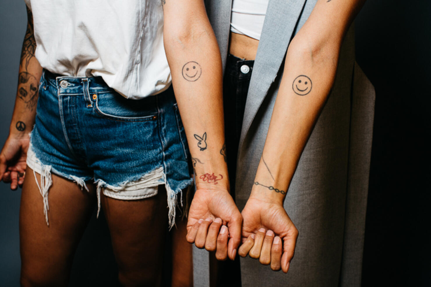 Smiley face forearm tattoos
