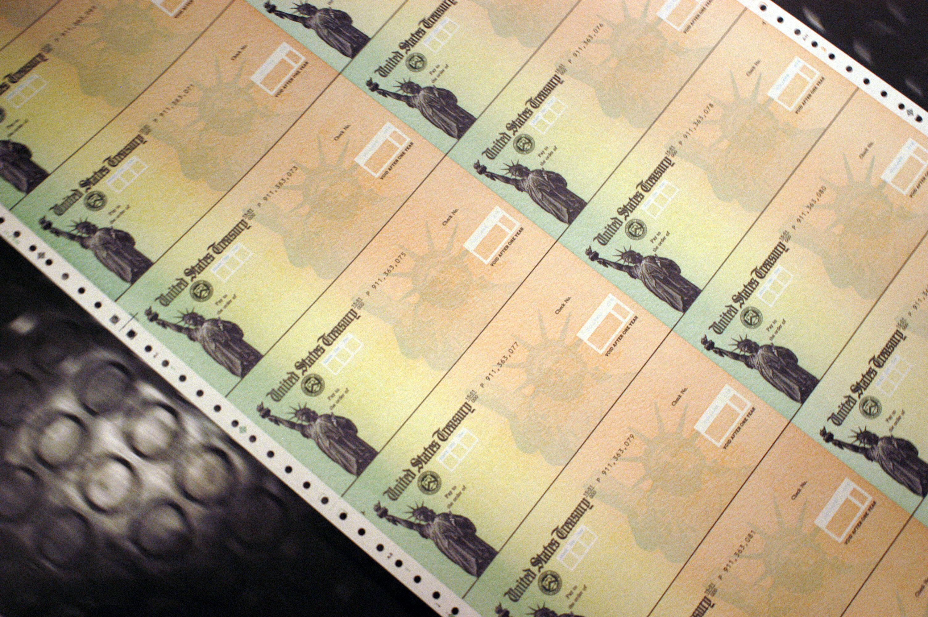 PHILADELPHIA - FEBRUARY 11: Blank Social Security checks are run through a printer at the U.S. Treasury printing facility February 11, 2005 in Philadelphia, Pennsylvania.  As U.S. President George W. Bush travels the country to stump for his plan to change the Social Security system, opposition continues from some members of Congress and senior citizen groups concerned that the proposal would erode guarantees to the federal retirement program. (Photo by William Thomas Cain/Getty Images)