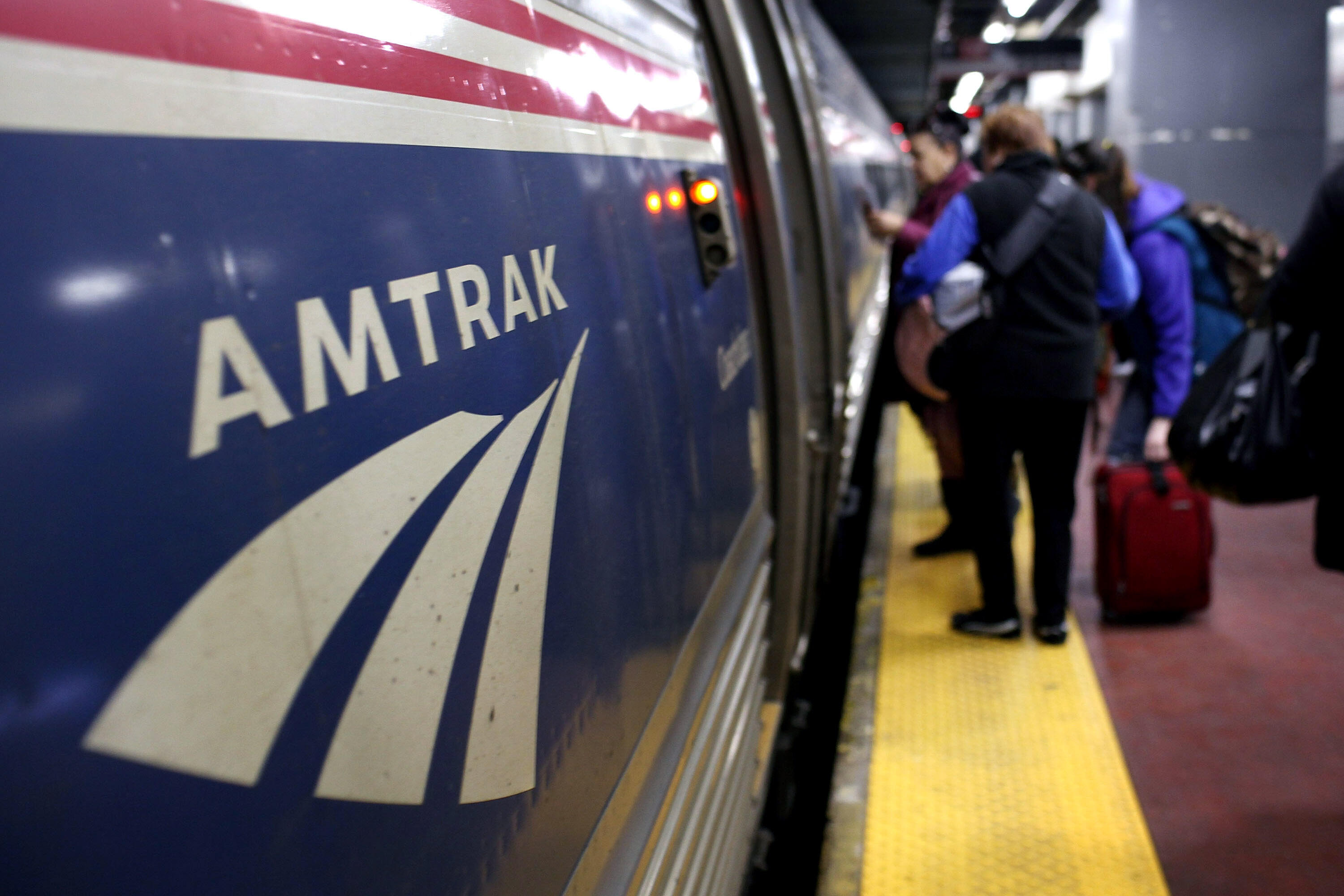 NEW YORK, NY - FEBRUARY 08:  People board an Amtrak train on February 8, 2011 at Penn Station in New York City. Amtrak, a government-owned corporation, has joined up with New Jersey's two U.S. senators to propose a new rail link to New York City under the Hudson River. The 