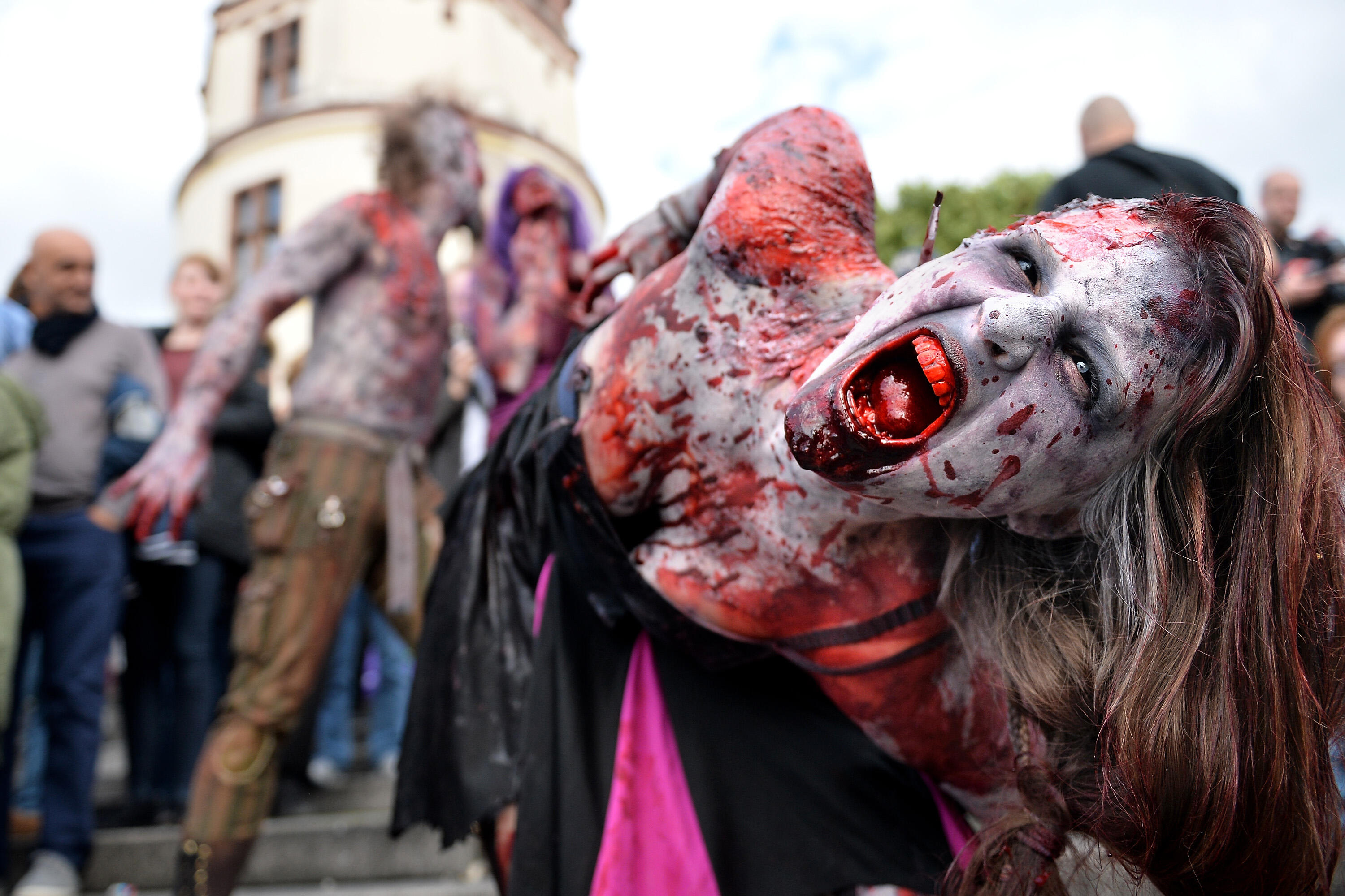 Participants take part at the Zombie Walk Duesseldorf along the Rheinuferpromenade on September 6, 2015 in Duesseldorf, Germany. A zombie walk is an organized public gathering of people who dress up in zombie costumes.