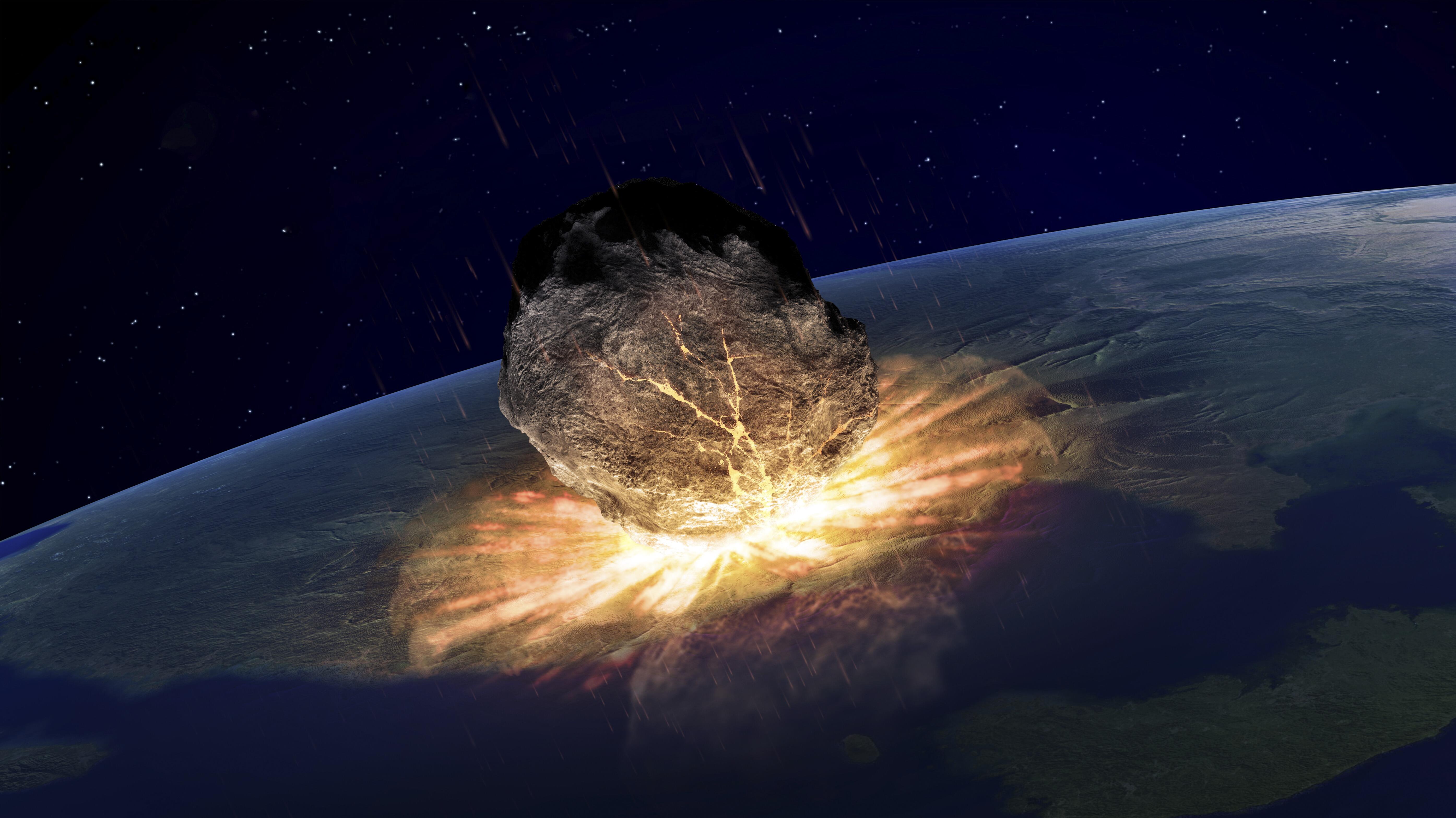 Artwork of an asteroid hitting earth.