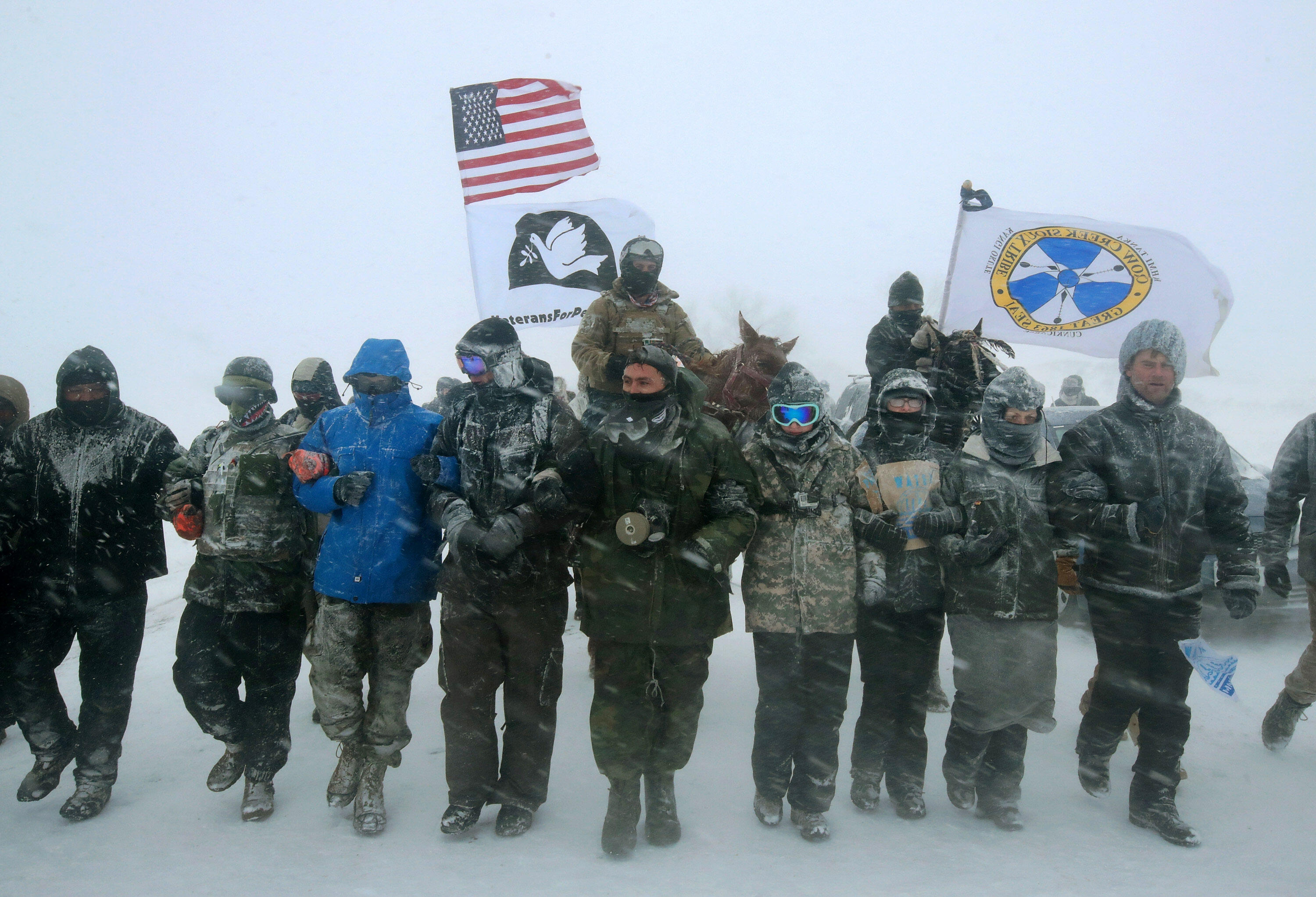 CANNON BALL, ND - DECEMBER 05:  Despite blizzard conditions, military veterans march in support of the 