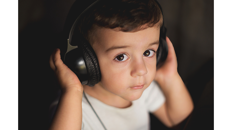 toddler boy with headphones