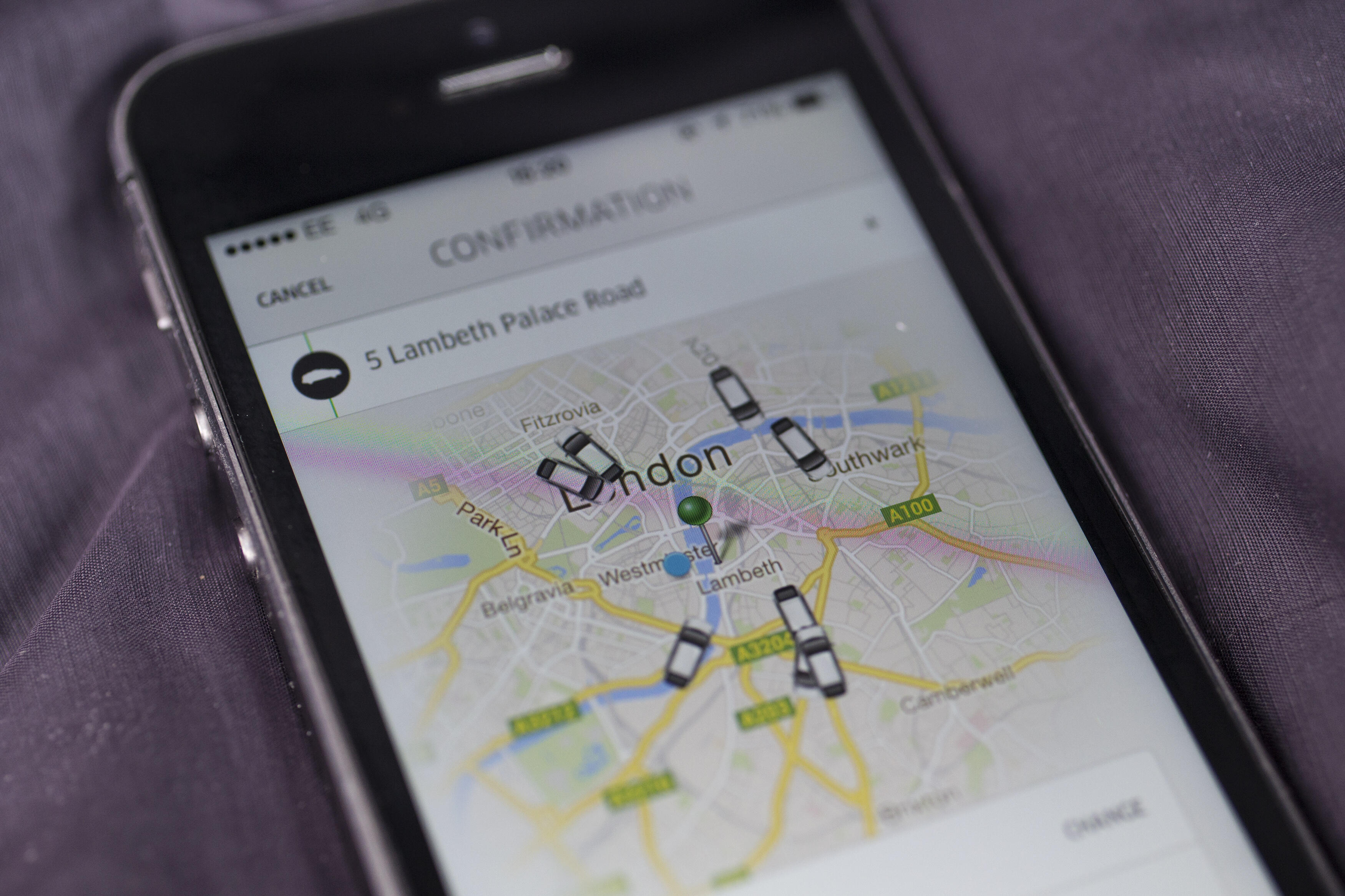 LONDON, ENGLAND - JUNE 02: In this photo illustration, a smartphone displays the 'Uber' mobile application which allows users to hail private-hire cars from any location on June 2, 2014 in London, England. The controversial piece of software, which is opp