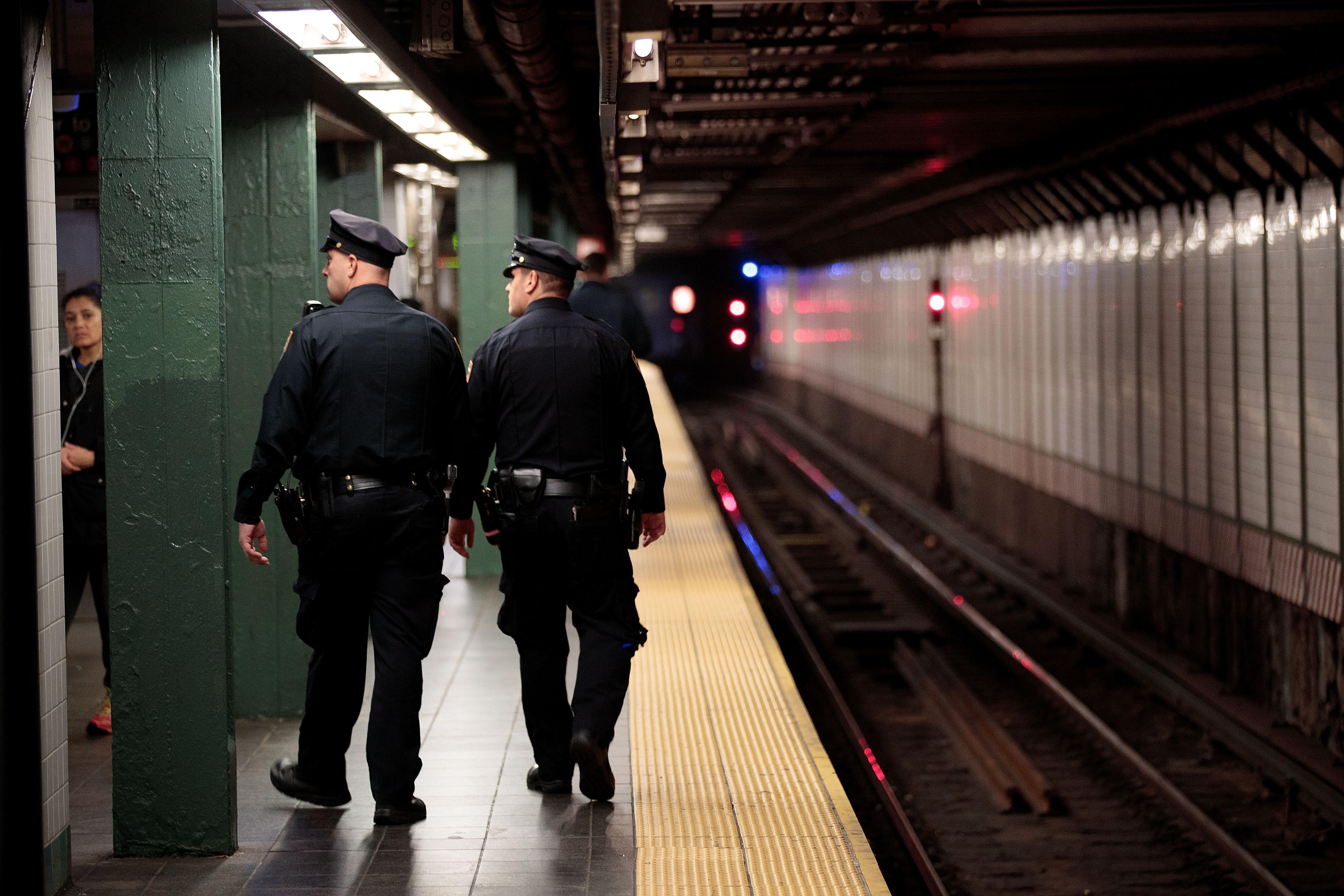 NEW YORK, NY - NOVEMBER 7: Members of the New York City Police patrol a subway station in Times Square, November 7, 2016 in New York City. With both presidential candidates holding their election night events in New York City, the NYPD has stepped up secu