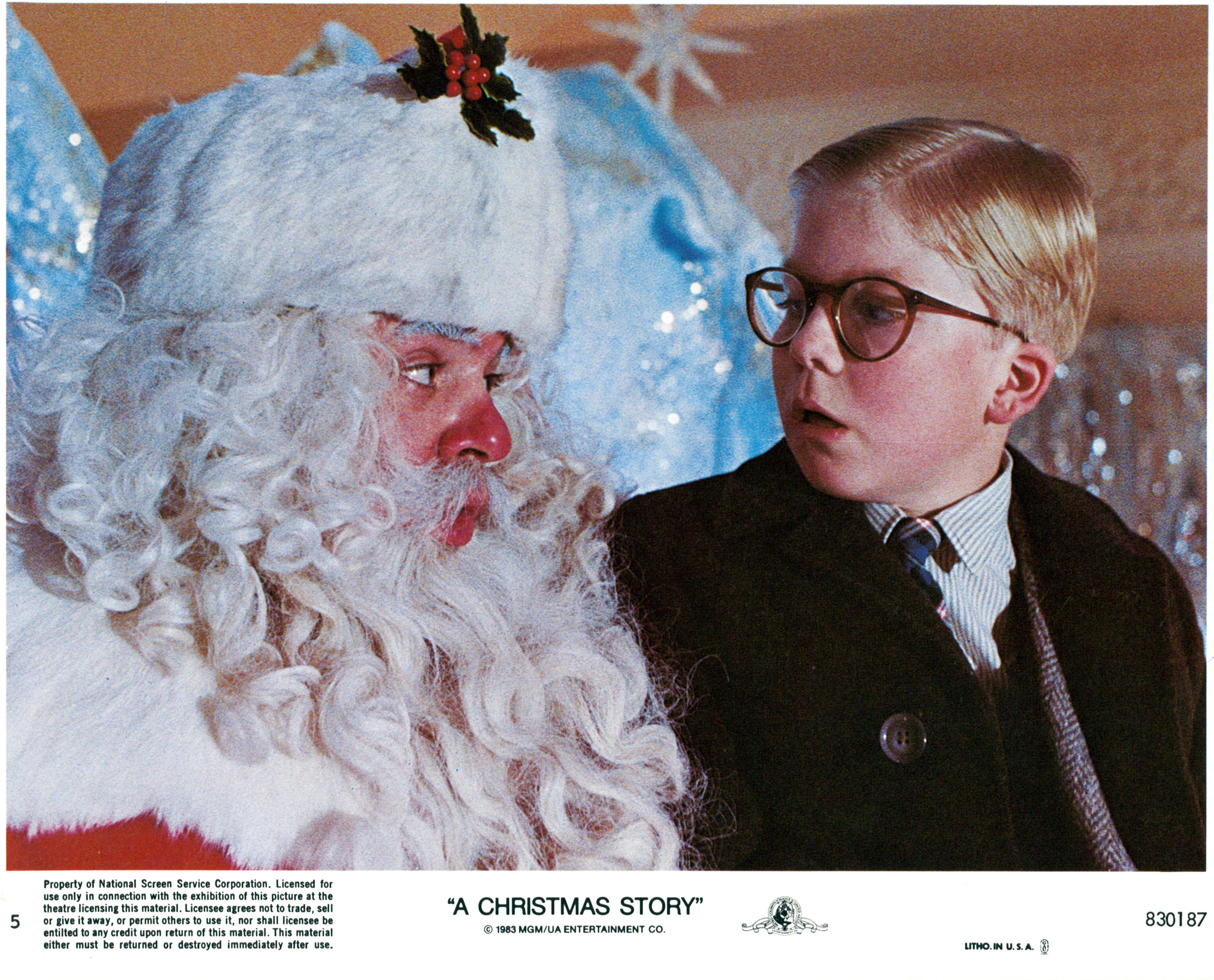 Peter Billingsley sits on Santa's lap in a scene from the film 'A Christmas Story', 1983. (Photo by Metro-Goldwyn-Mayer/Getty Images)