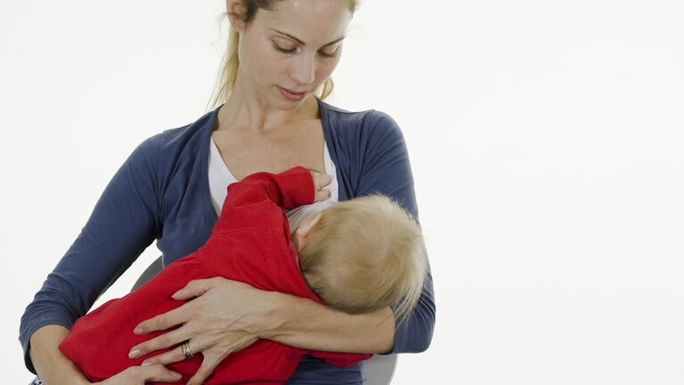 Mother breastfeeding her baby.