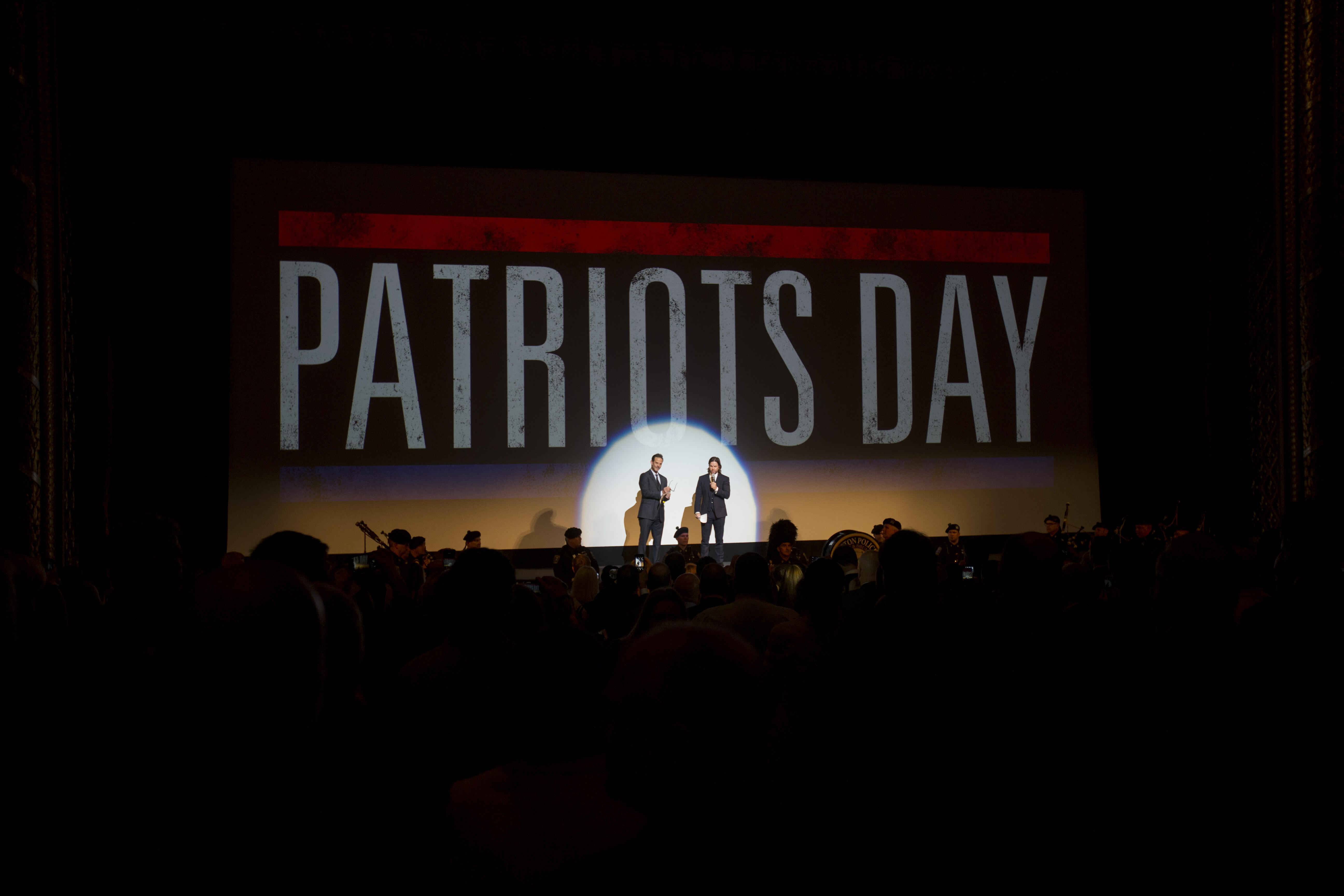 BOSTON, MA - DECEMBER 14:  Director Peter Berg, left and Producer and Actor Mark Wahlberg speaks to the audience before the Special Boston screening of Patriots Day at Wang Theatre on December 14, 2016 in Boston, Massachusetts.  (Photo by Scott Eisen/Gett