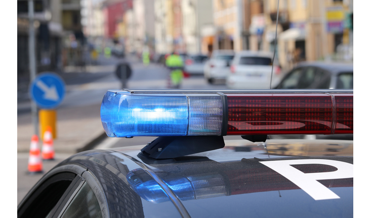 The blue and red flashing sirens of a police car