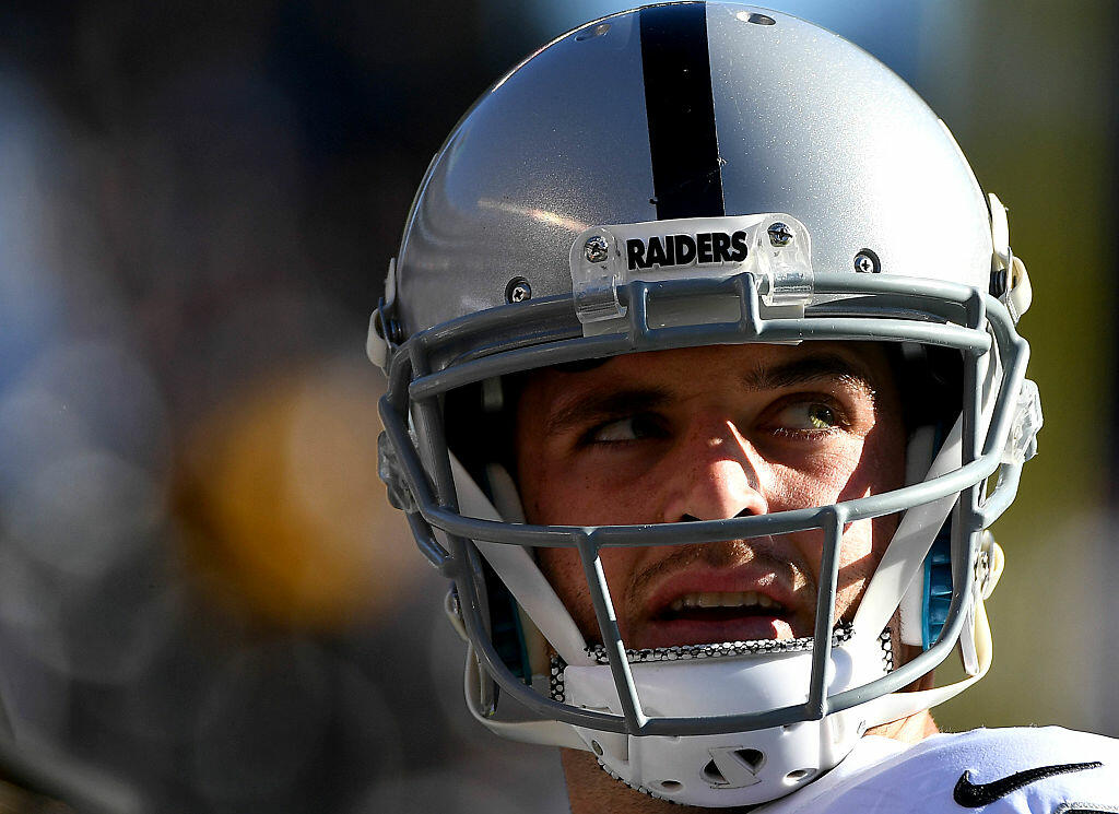 SAN DIEGO, CA - DECEMBER 18:  Quarterback Derek Carr #4 of the Oakland Raiders looks on front he sidelines during his team's game against the San Diego Chargers at Qualcomm Stadium on December 18, 2016 in San Diego, California. (Photo by Donald Miralle/Getty Images)