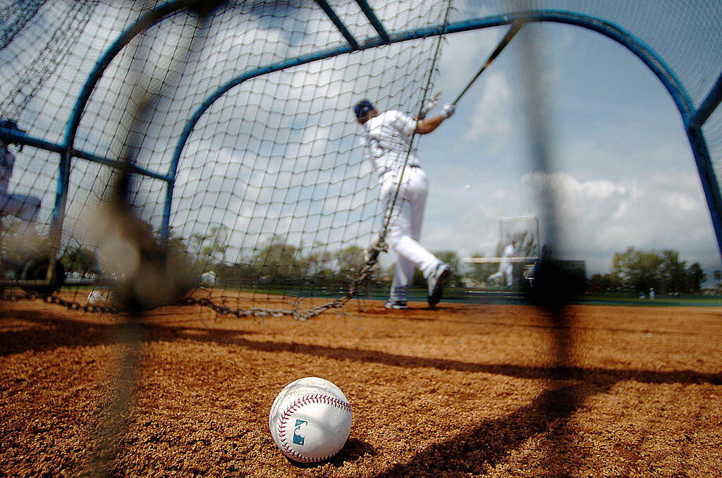VERO BEACH, UNITED STATES:  Los Angeles Dodgers infielder Cesar Izturis follows through while running batting drills during a practice session at team's Spring Training center in Vero Beach, Florida, 24 February 2005.  AFP PHOTO / Roberto SCHMIDT  (Photo 