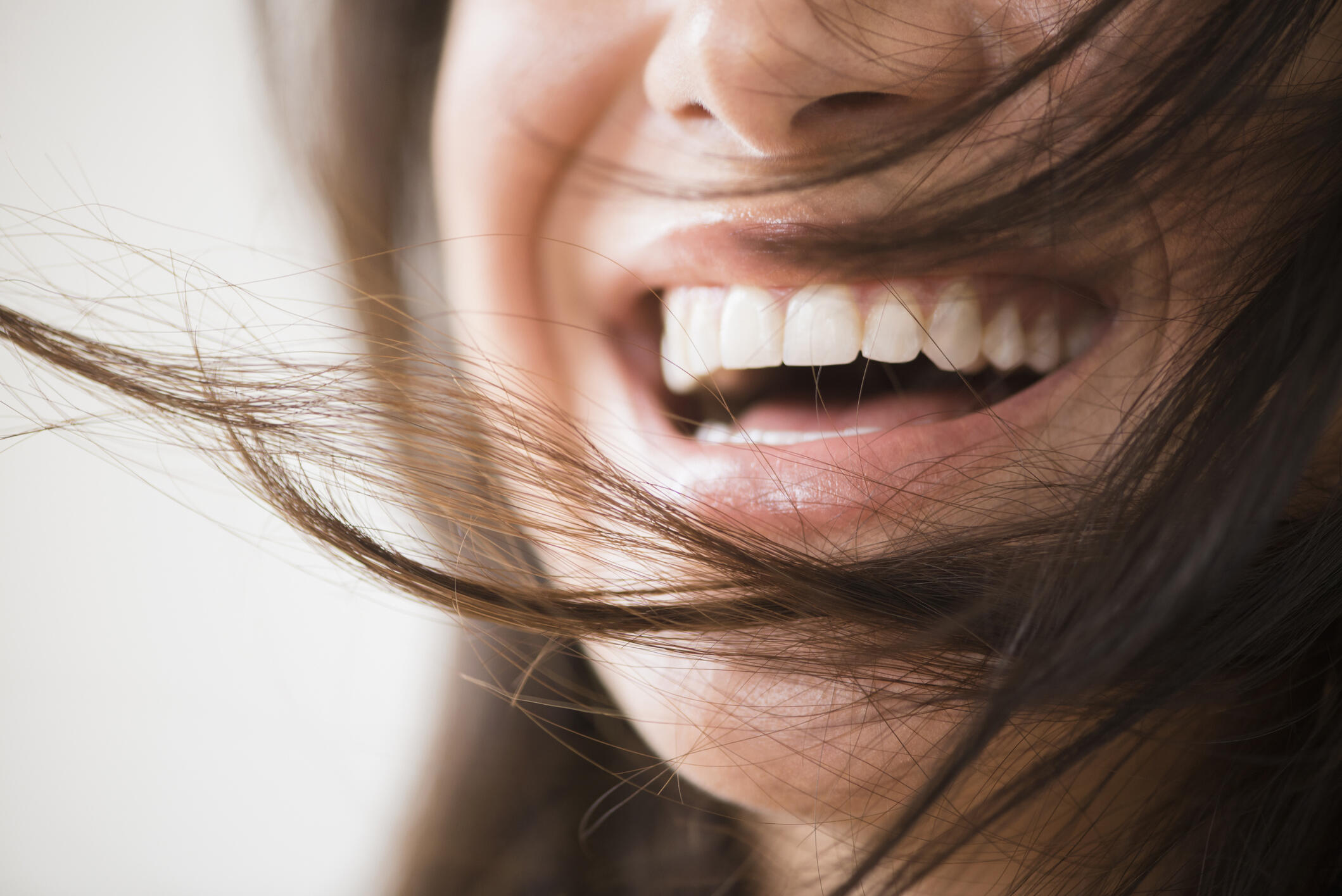 Close up of laughing woman with messy hair