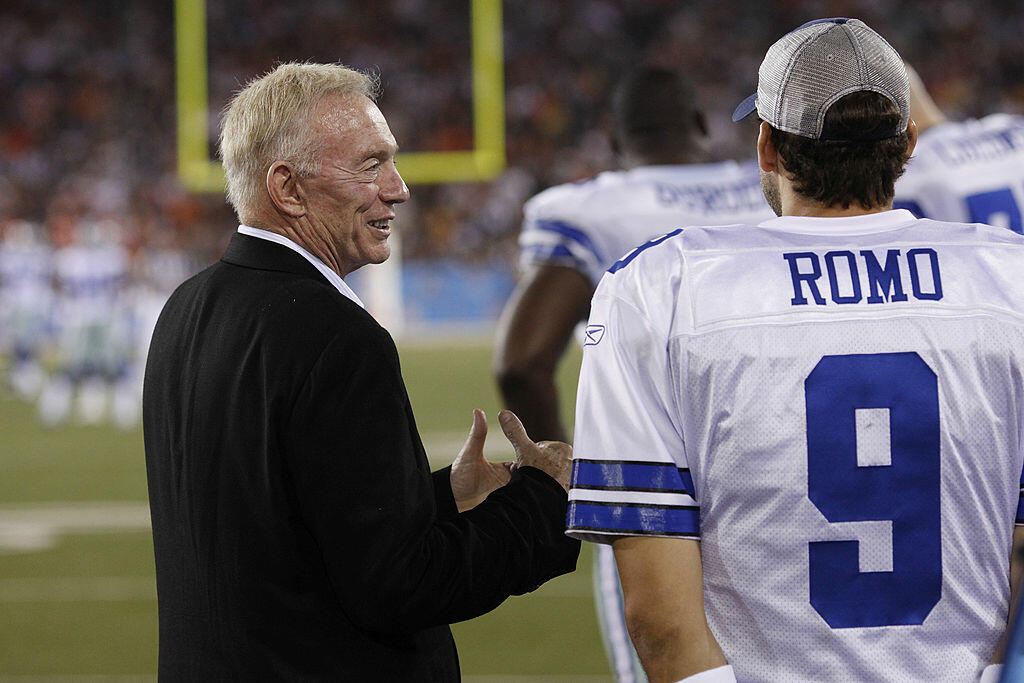 CANTON, OH - AUGUST 8: Dallas Cowboys owner Jerry Jones talks with Tony Romo #9 on the sidelines against the Cincinnati Bengals during the 2010 Pro Football Hall of Fame Game at the Pro Football Hall of Fame Field at Fawcett Stadium on August 8, 2010 in C
