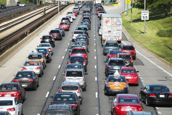 CHICAGO, IL - MAY 23:  Traffic jams up on the Kennedy Expressway leaving the city for the Memorial Day weekend on May 23, 2014 in Chicago, Illinois. AAA forecasts the number of drivers taking to the roads for the holiday will hit a 10-year record. The motor club expects roughly eight in ten Americans to take a road trip during the long weekend.  (Photo by Scott Olson/Getty Images)