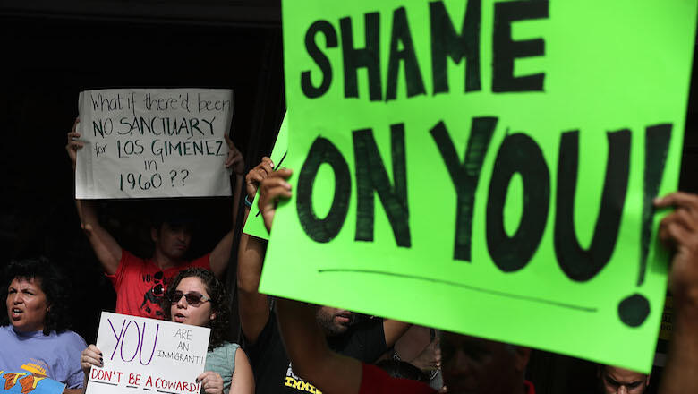 MIAMI, FL - JANUARY 27:  Protesters against Miami-Dade Mayor Carlos Gimenez's decision to abide by President Donald Trump's order, that any 