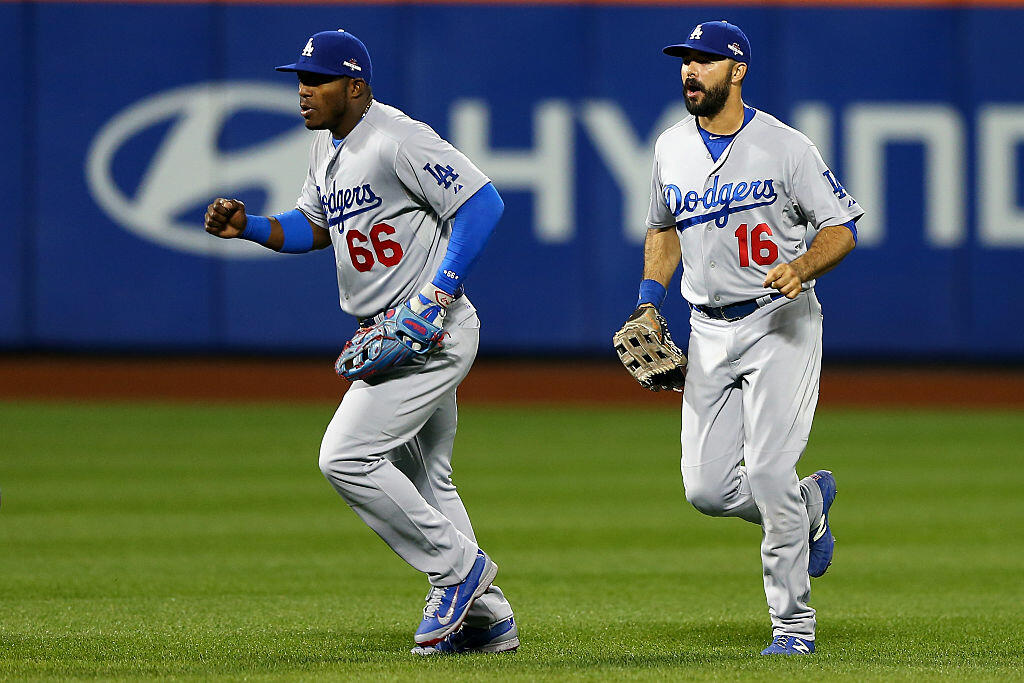 NEW YORK, NY - OCTOBER 13:  Yasiel Puig #66 and Andre Ethier #16 of the Los Angeles Dodgers celebrate after defeating the New York Mets in game four of the National League Division Series at Citi Field on October 13, 2015 in New York City.  The Dodgers defeated the Mets with a score of 3 to 1.  (Photo by Elsa/Getty Images)