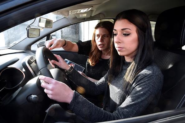 A French driving instructor (L) talks to a student practising for the driving license in a car of an auto-ecole (driving-school) in le Mans, northwestern France, on December 16, 2016. / AFP / JEAN-FRANCOIS MONIER        (Photo credit should read JEAN-FRANCOIS MONIER/AFP/Getty Images)