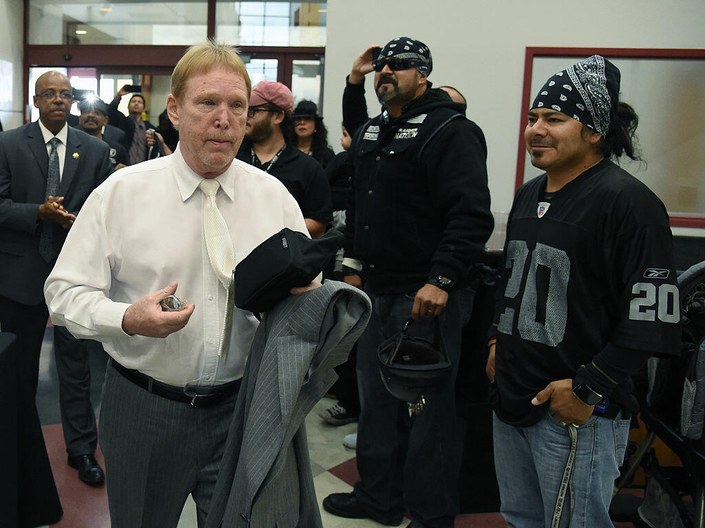 LAS VEGAS, NV - APRIL 28:  Oakland Raiders owner Mark Davis walks past Raiders fans as he arrives at a Southern Nevada Tourism Infrastructure Committee meeting at UNLV on April 28, 2016 in Las Vegas, Nevada. Davis told the committee he is willing to spend USD 500 million as part of a deal to move the team to Las Vegas if a proposed USD 1.3 billion, 65,000-seat domed stadium is built by casino magnate Sheldon Adelson's Las Vegas Sands Corp. and real estate agency Majestic Realty, possibly on a vacant 42-acre lot a few blocks east of the Las Vegas Strip recently purchased by UNLV.  (Photo by Ethan Miller/Getty Images)