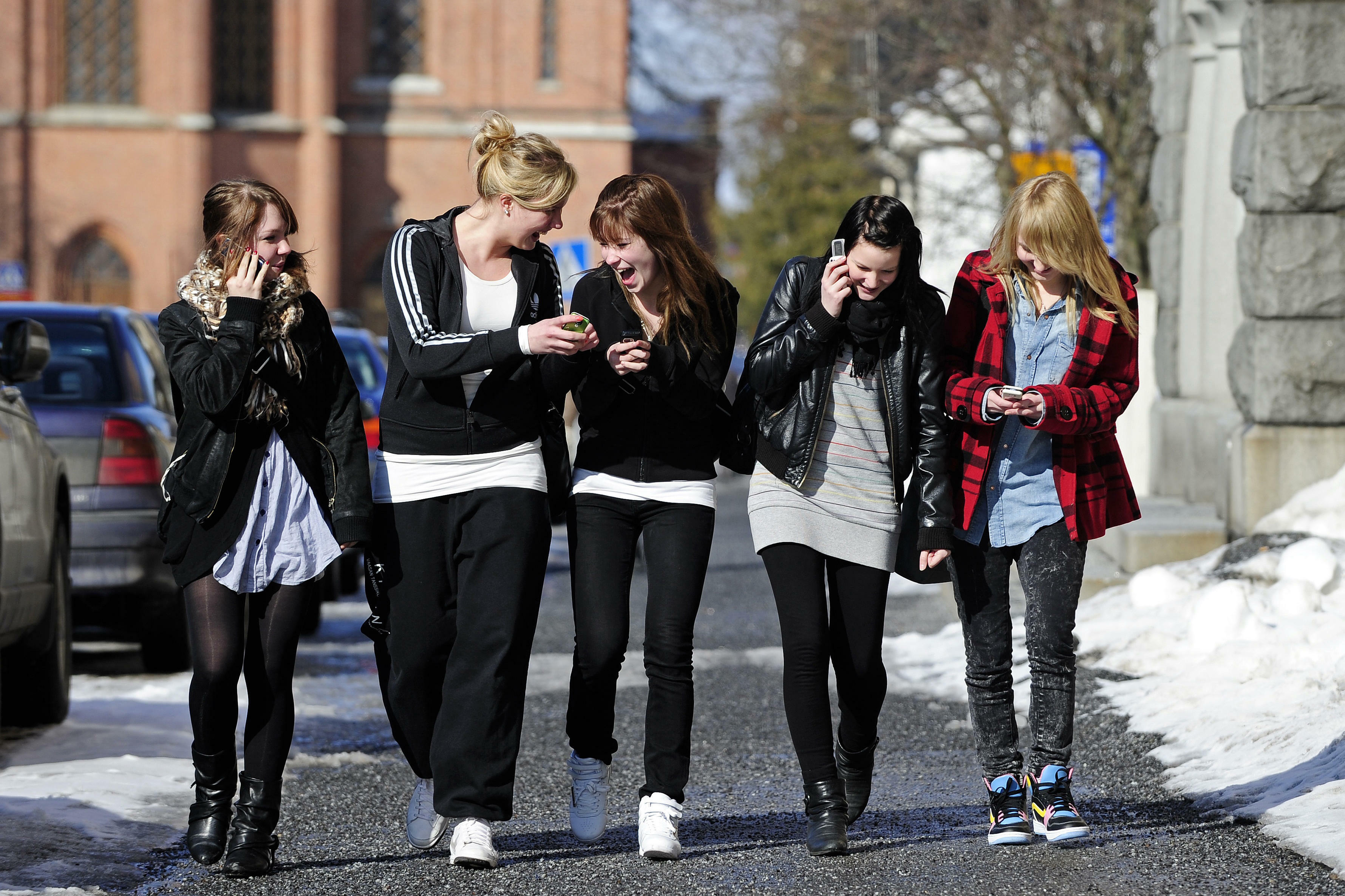 Teenagers use their cell phones after school time in Vaasa, Finland, on March 30, 2010.      AFP PHOTO / OLIVIER MORIN (Photo credit should read OLIVIER MORIN/AFP/Getty Images)