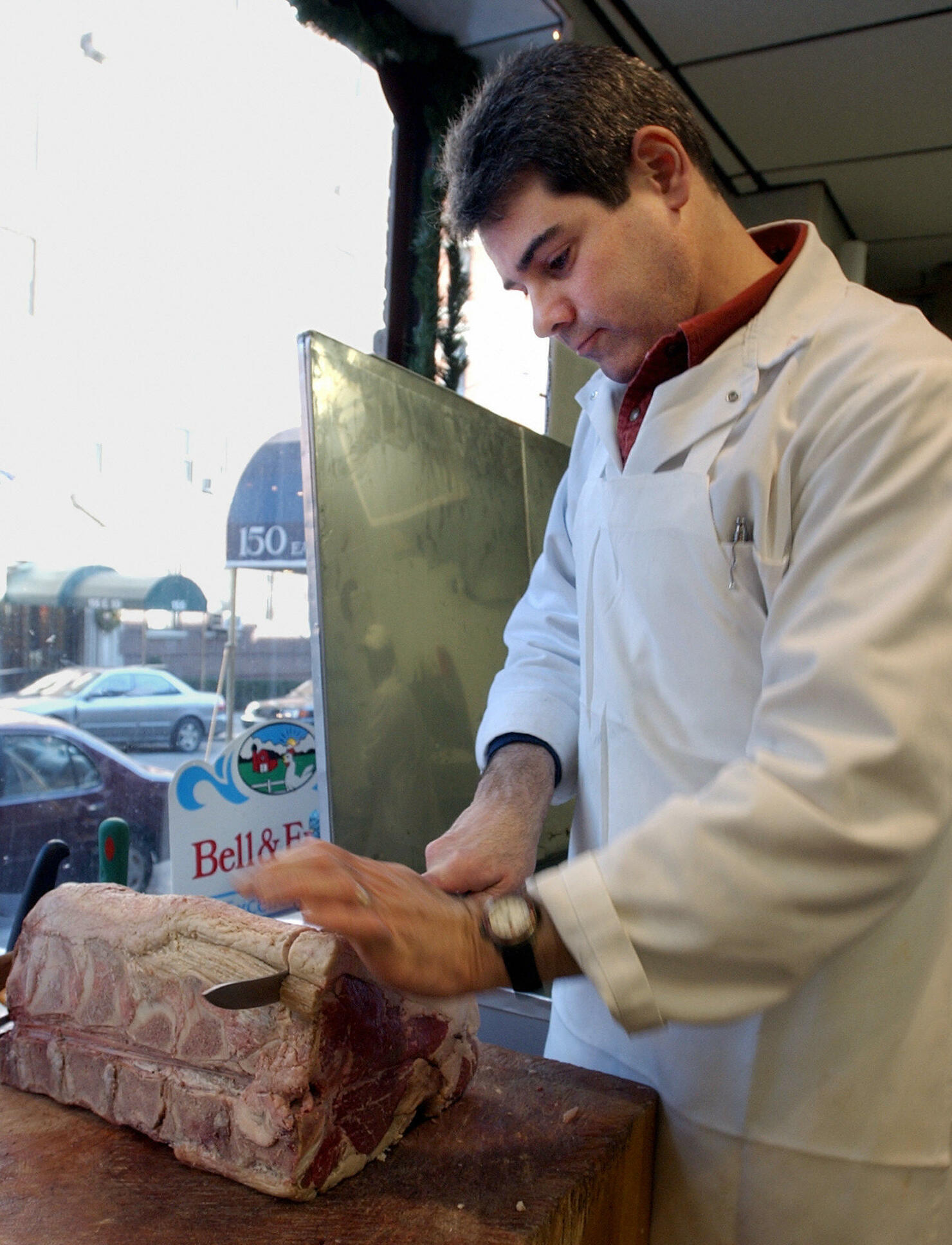 Evan Kemp cuts a prime rib beef roast, 2