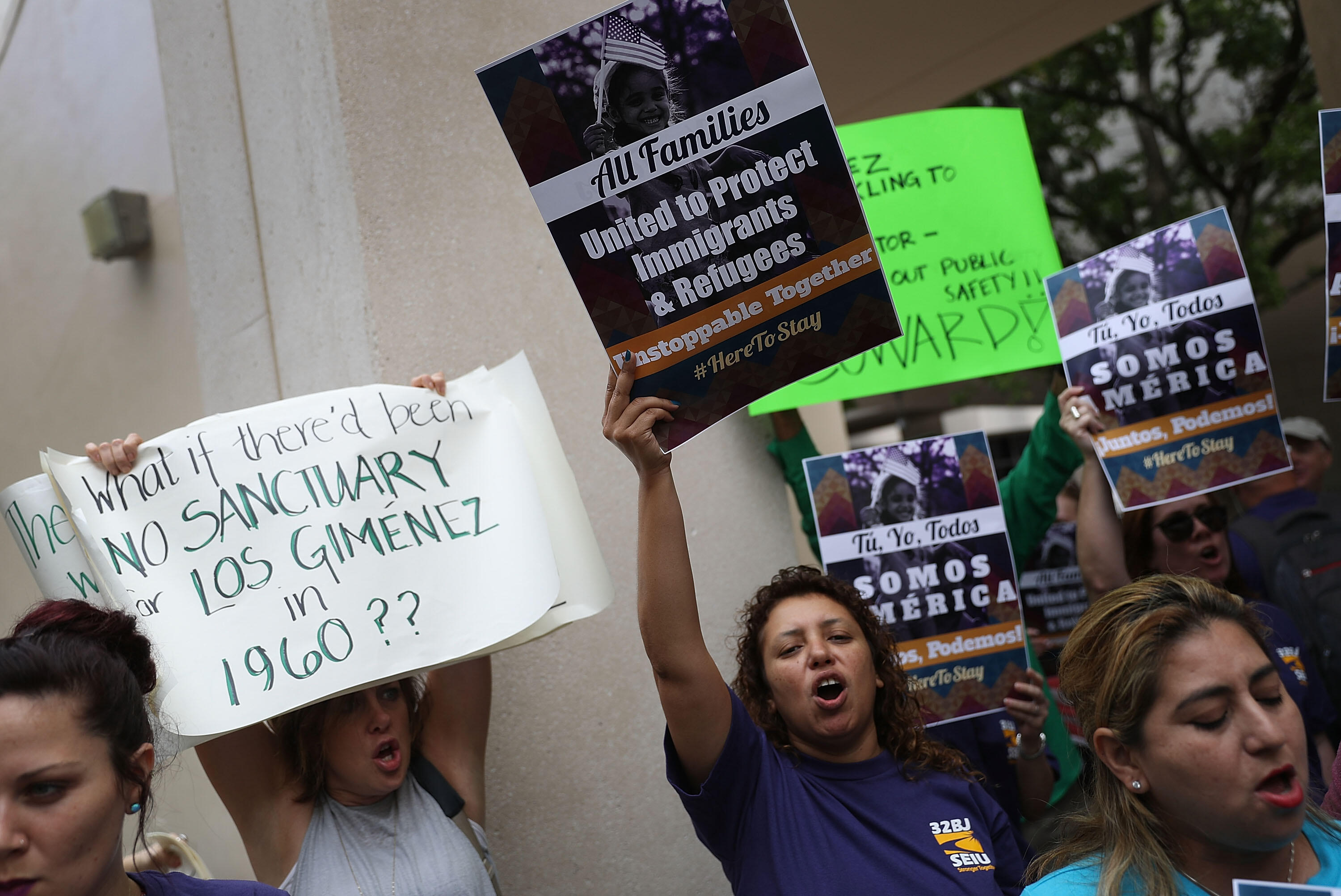 MIAMI, FL - JANUARY 27:  Protesters against Miami-Dade Mayor Carlos Gimenez's decision to abide by President Donald Trump's order, that any 