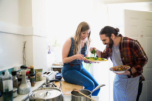 Couple cooking in kitchen