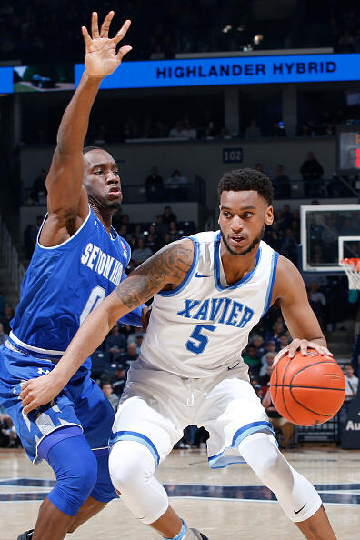 CINCINNATI, OH - FEBRUARY 01: Trevon Bluiett #5 of the Xavier Musketeers handles the ball against Khadeen Carrington #0 of the Seton Hall Pirates in the first half of the game at Cintas Center on February 1, 2017 in Cincinnati, Ohio. (Photo by Joe Robbins/Getty Images)