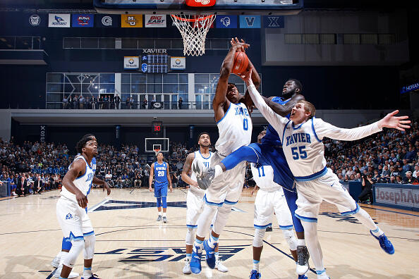 CINCINNATI, OH - FEBRUARY 01: J.P. Macura #55 and Tyrique Jones #0 of the Xavier Musketeers fight for a rebound against Michael Nzei #1 of the Seton Hall Pirates in the second half of the game at Cintas Center on February 1, 2017 in Cincinnati, Ohio. Xavier defeated Seton Hall 72-70. (Photo by Joe Robbins/Getty Images)