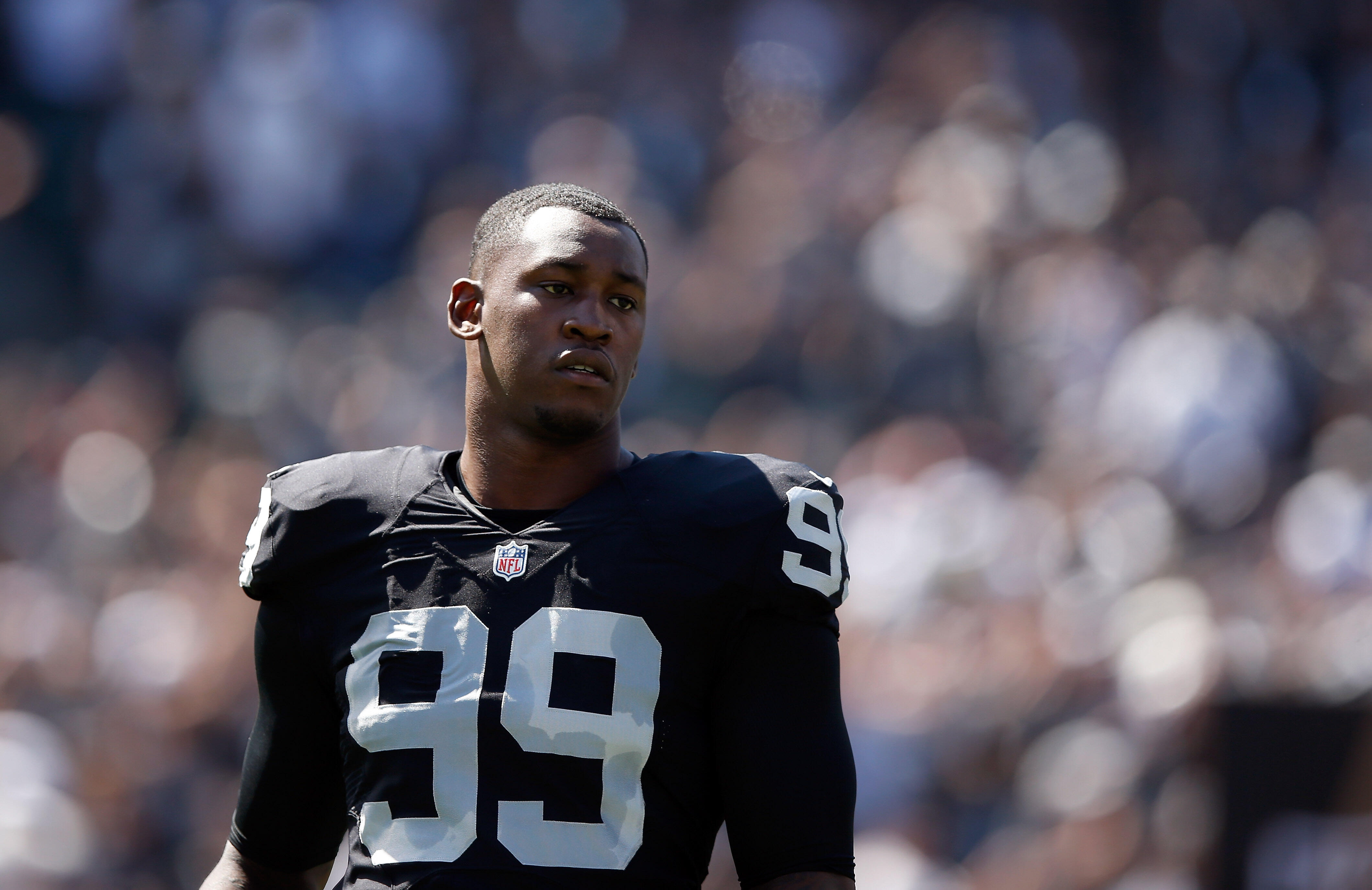 OAKLAND, CA - SEPTEMBER 20:  Aldon Smith #99 of the Oakland Raiders stands on the field before their game against the Baltimore Ravens at O.co Coliseum on September 20, 2015 in Oakland, California.  (Photo by Ezra Shaw/Getty Images)