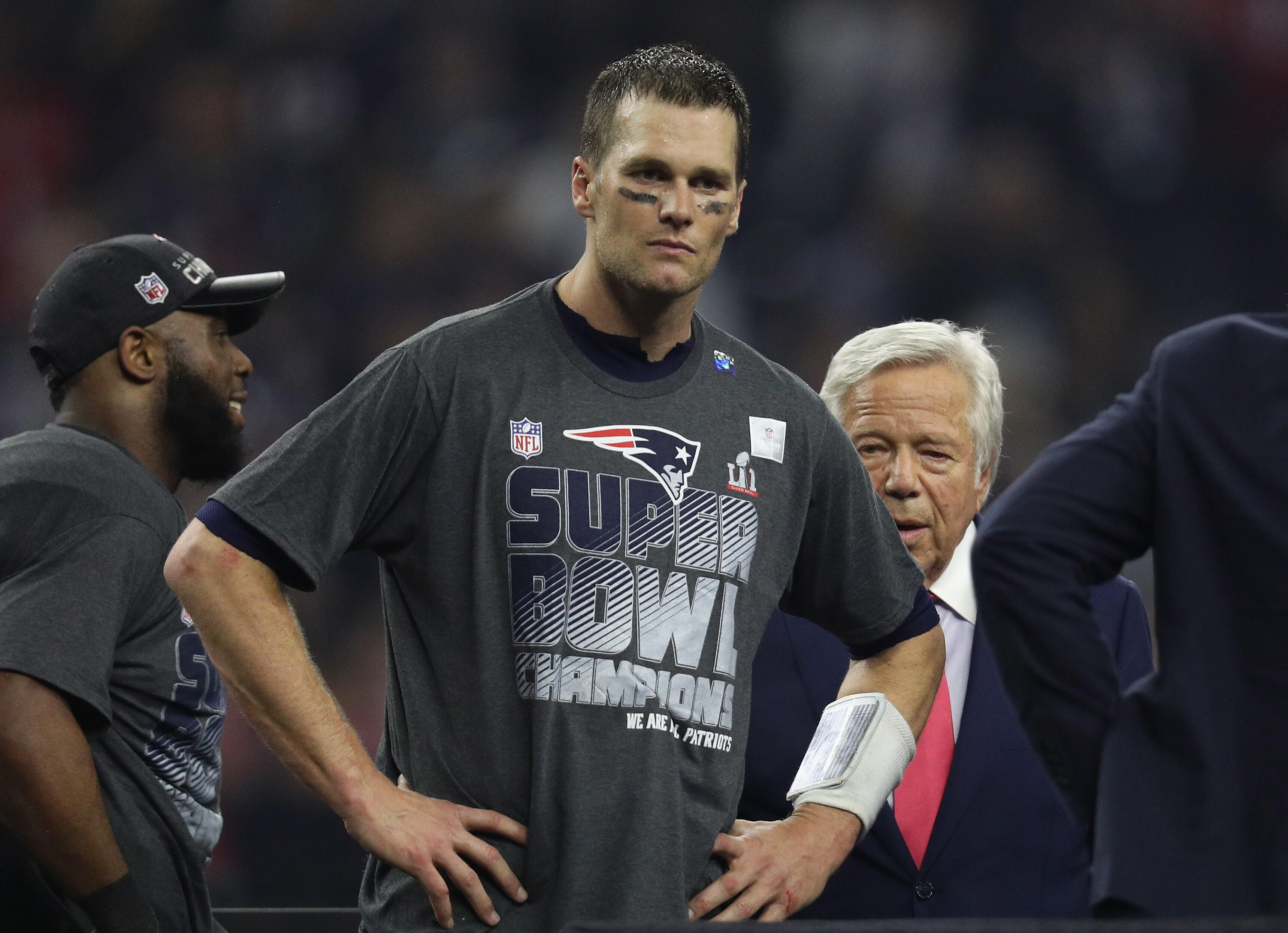 HOUSTON, TX - FEBRUARY 05: Tom Brady #12 of the New England Patriots and New England Patriots owner Robert Kraft look on before the trophy ceremony celebrating the Patriots 34-28 win over the Atlanta Falcons in overtime of Super Bowl 51 at NRG Stadium on 