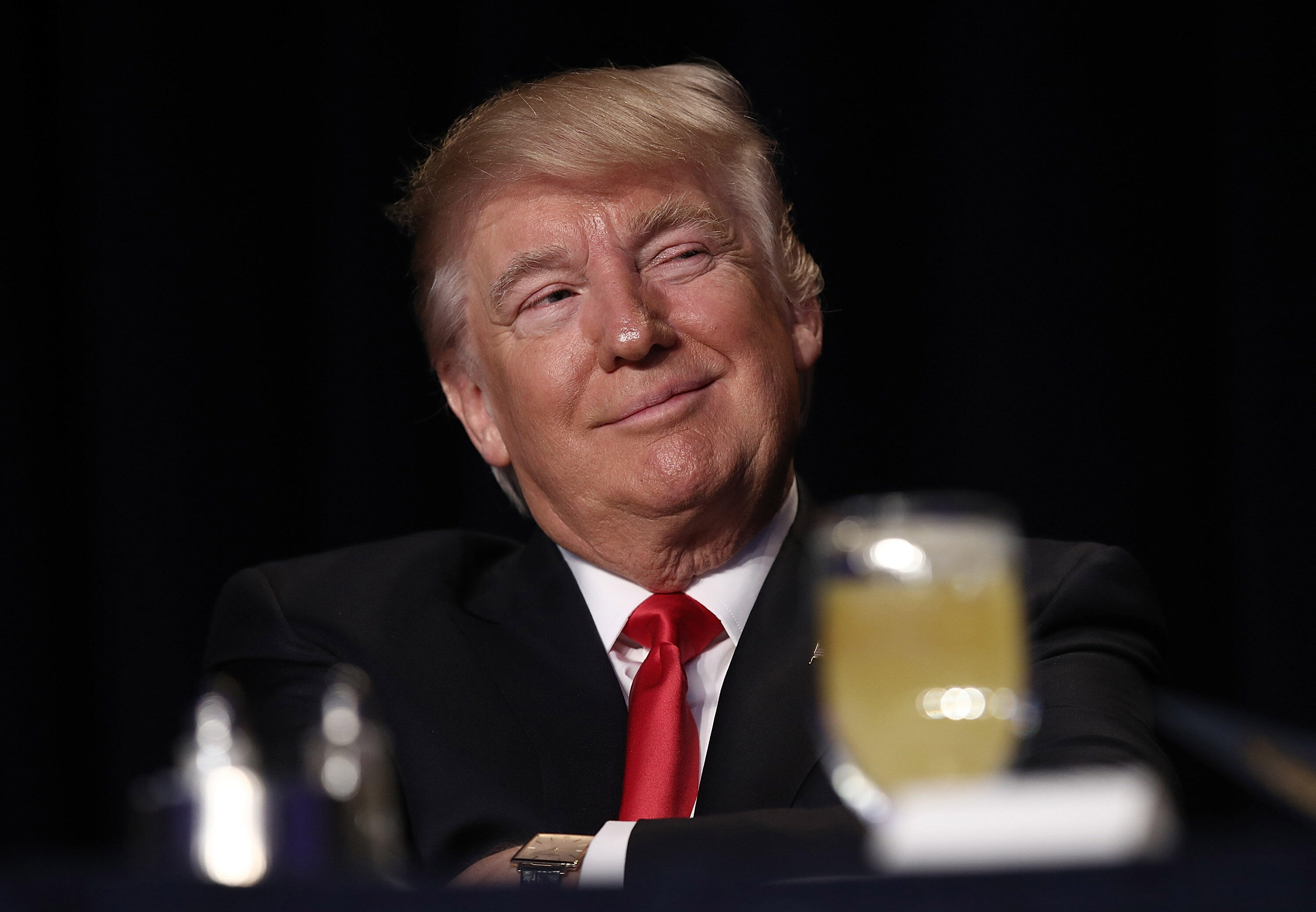 WASHINGTON, DC - FEBRUARY 02: (AFP OUT) U.S. President Donald Trump listens as television producer Mark Burnett introduces him at the National Prayer Breakfast February 2, 2017 in Washington, DC. Every U.S. president since Dwight Eisenhower has addressed 