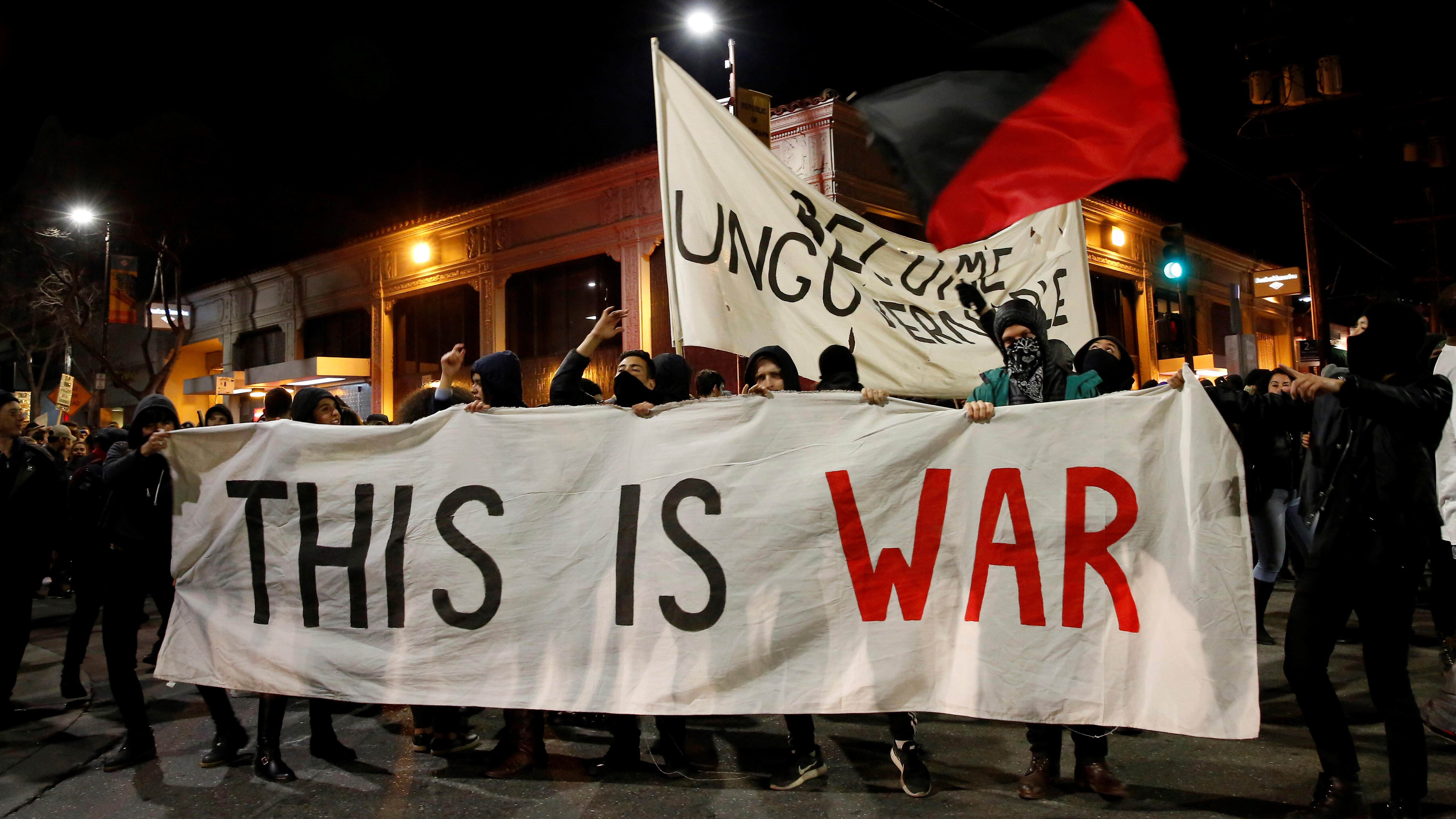 BERKELEY, UNITED STATES - FEBRUARY 2: A group of protesters hold a banner reading 