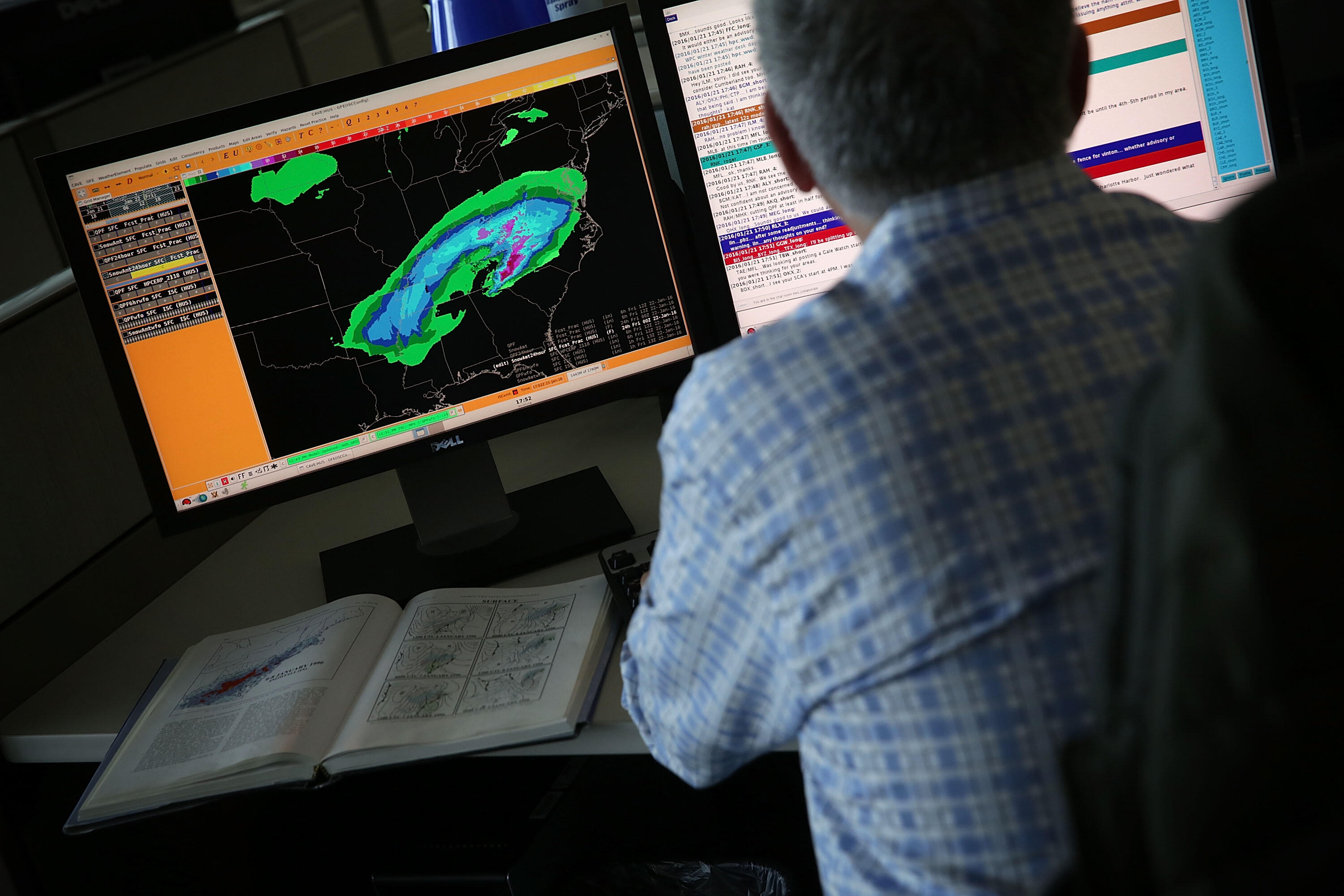 WASHINGTON, DC - JANUARY 21:  A forecaster analyses data of an incoming winter storm January 21, 2016 at the NOAA Center for Weather and Climate Prediction in College Park, Maryland. A winter snowstorm is forecasted for the East Coast this weekend with pr