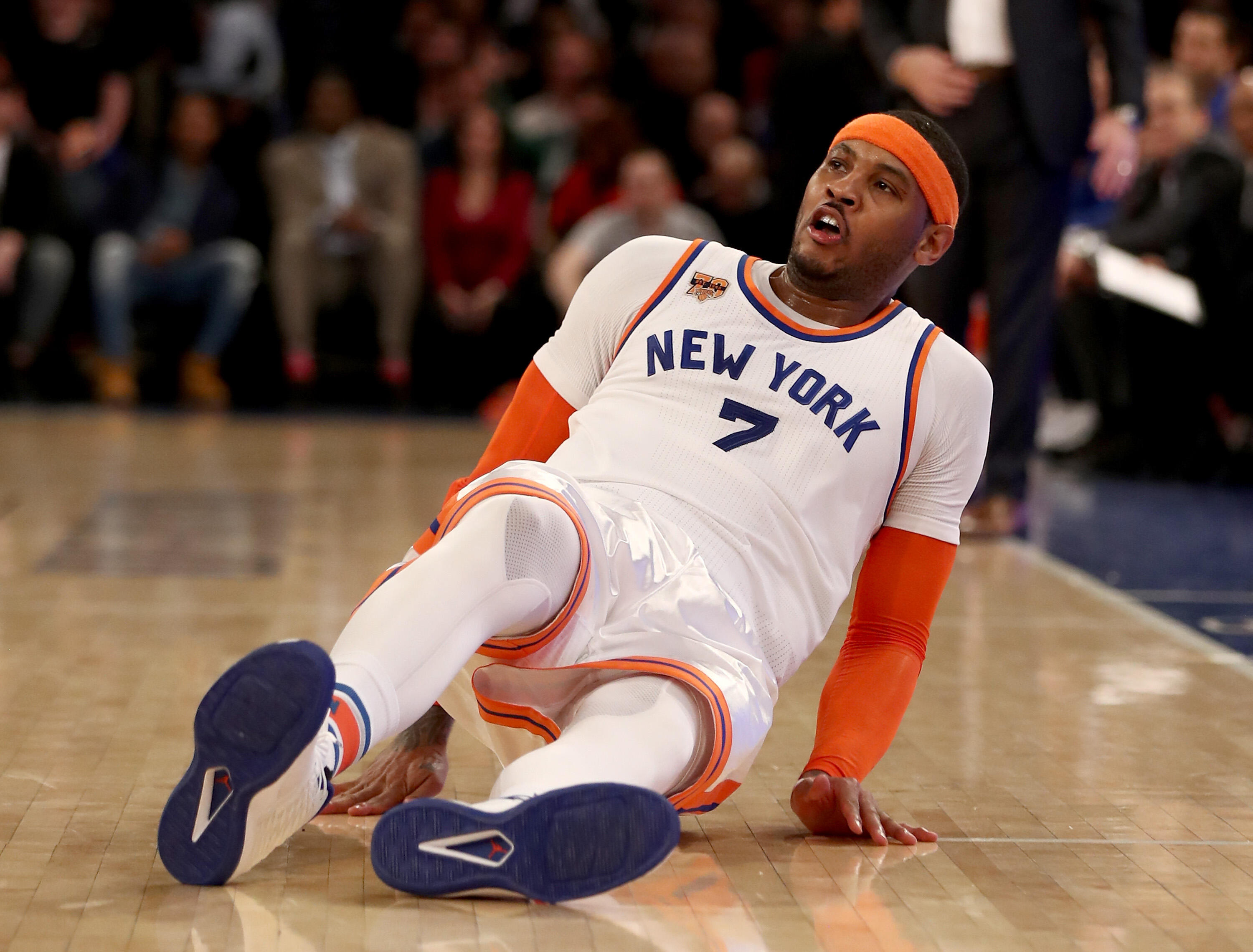 NEW YORK, NY - JANUARY 27:  Carmelo Anthony #7 of the New York Knicks falls as he follows through on a shot in the fourth quarter against the Charlotte Hornets at Madison Square Garden on January 27, 2017 in New York City. NOTE TO USER: User expressly ack