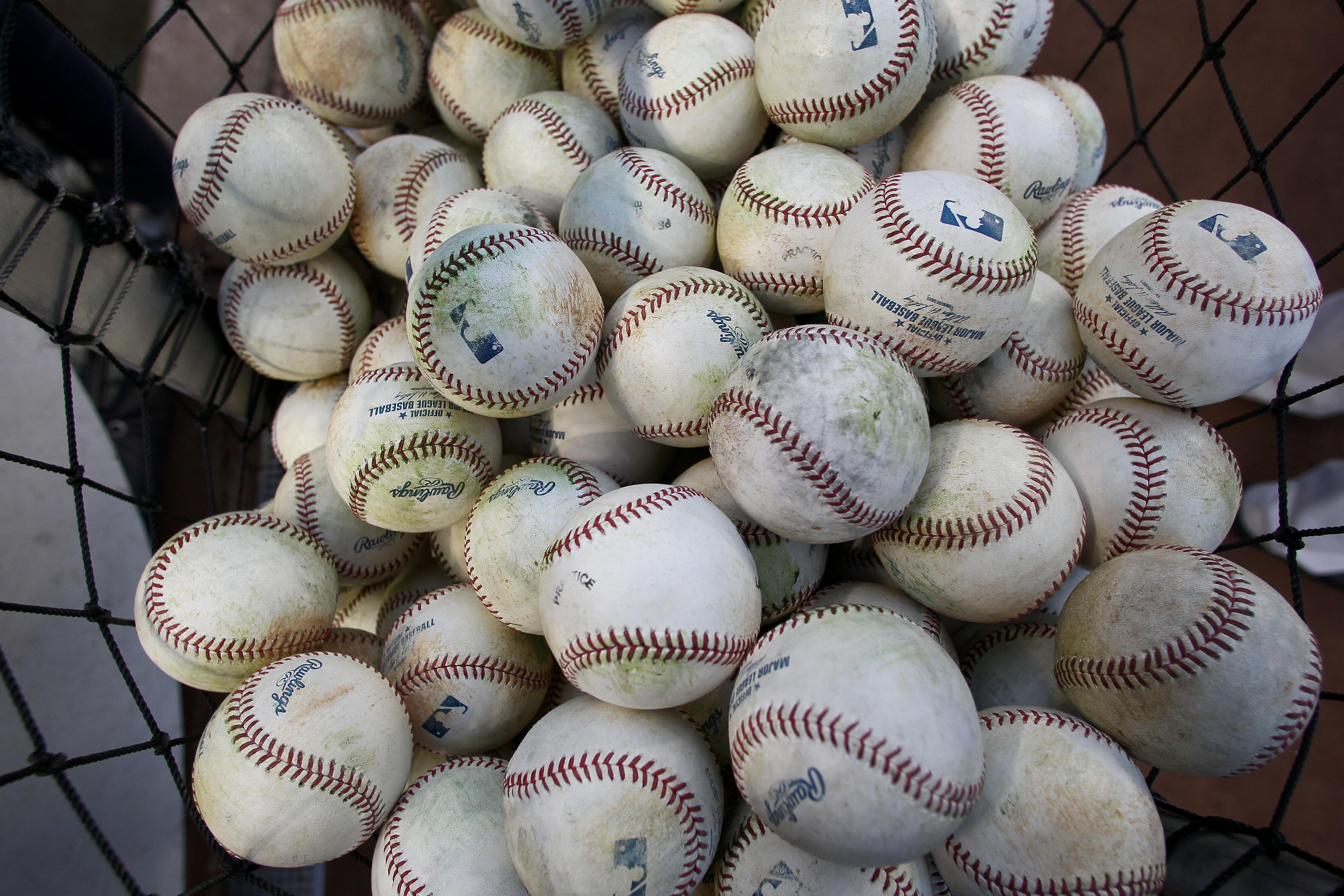NEW YORK, NY - OCTOBER 13:  A detail of official major league baseballs are seen in a bucket during batting practice between the New York Yankees and the Detroit Tigers during Game One of the American League Championship Series at Yankee Stadium on Octobe