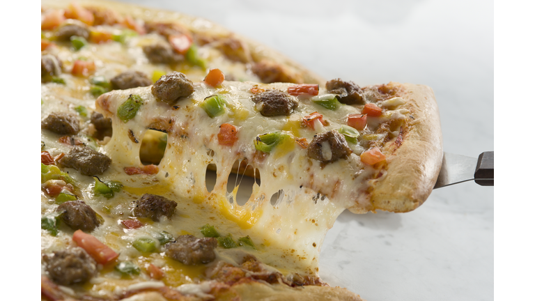 Sausage pizza being served