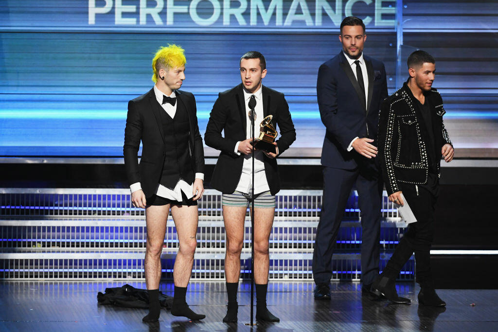 LOS ANGELES, CA - FEBRUARY 12:  Recording artists Josh Dun (L) and Tyler Joseph (C) of music group Twenty One Pilots accept the Best Pop Duo/Group Performance award for 'Stressed Out' onstage during The 59th GRAMMY Awards at STAPLES Center on February 12, 2017 in Los Angeles, California.  (Photo by Kevin Winter/Getty Images for NARAS)